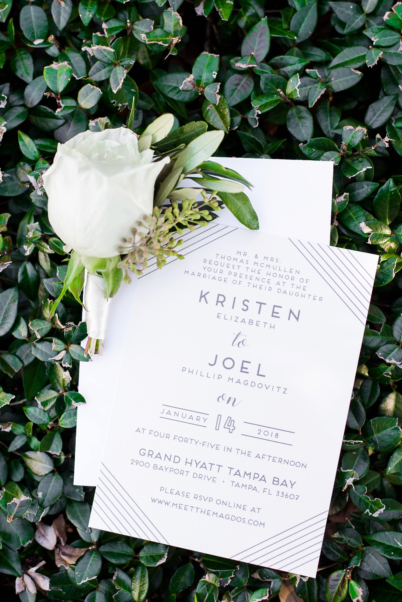 Wedding Invitations with white rose on greenery