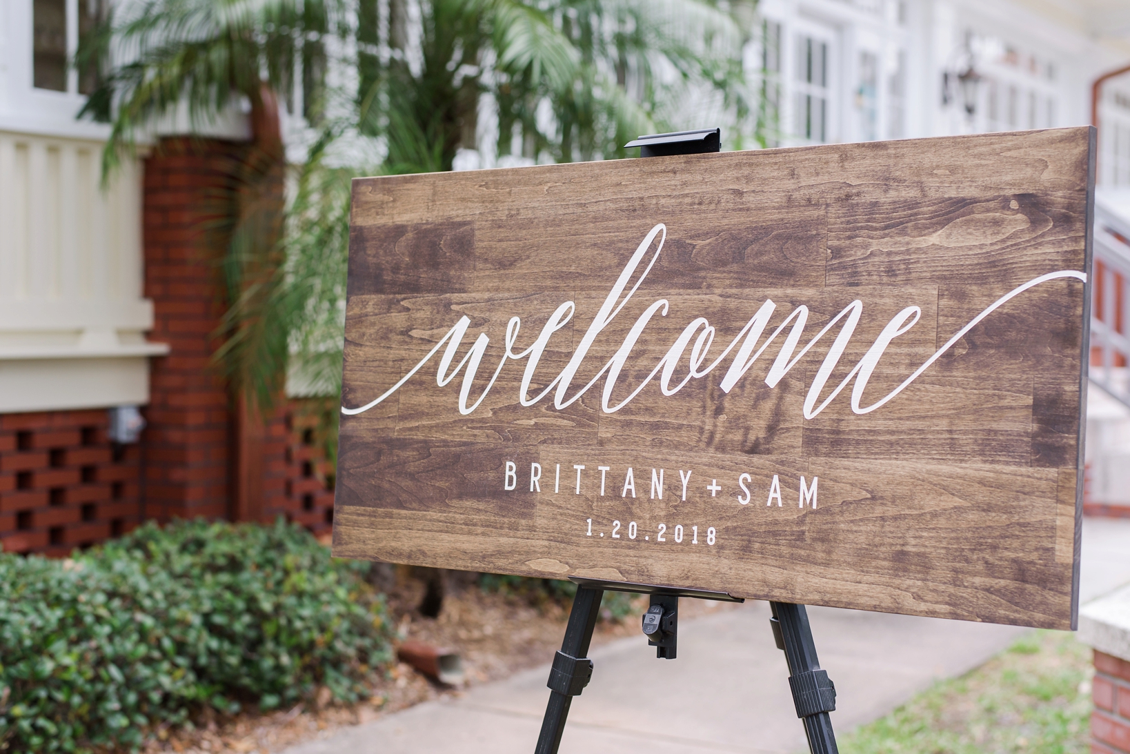 rustic Welcome sign with white cursive writing