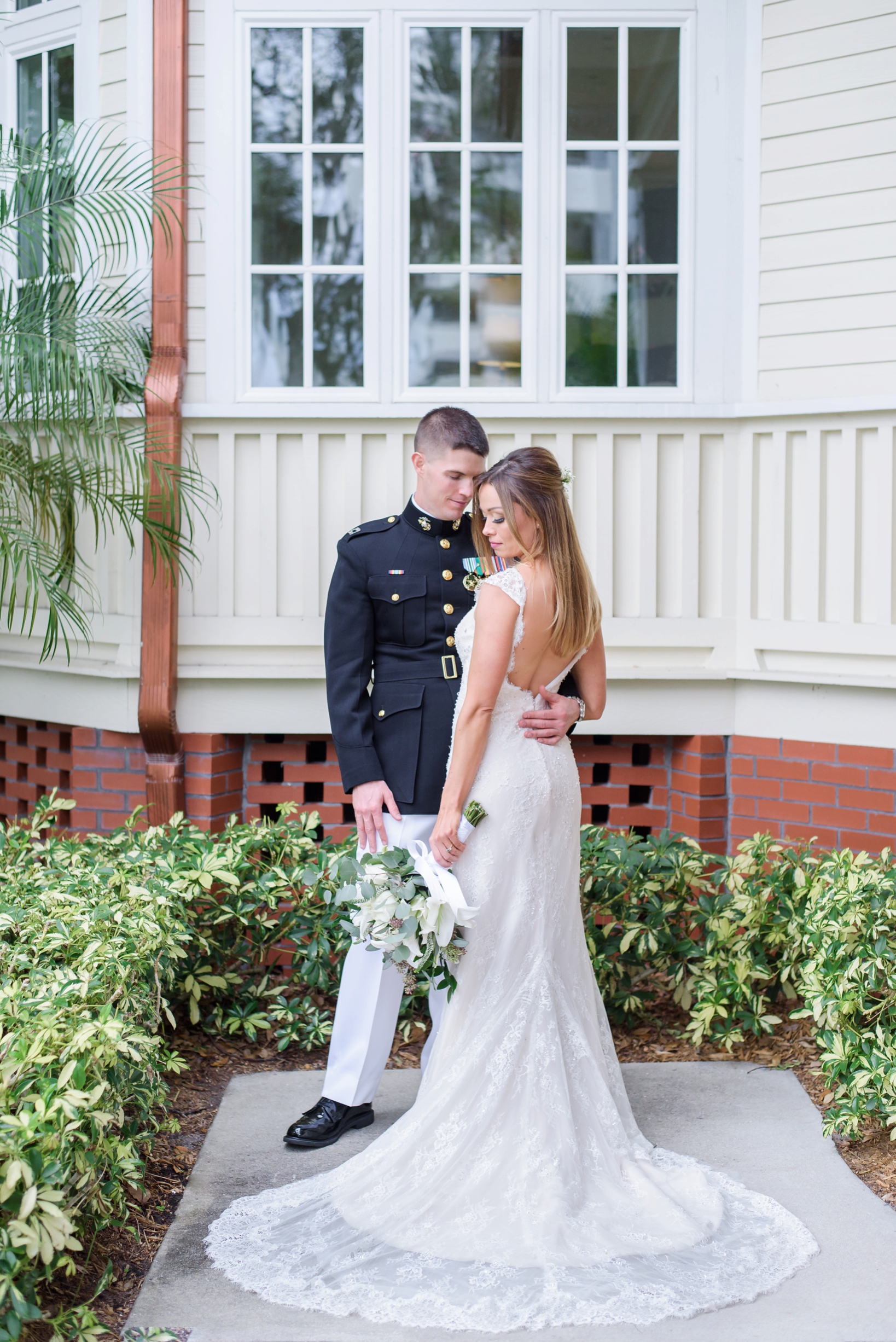 Bride and Groom in front of the palmetto riverside BnB by Sarah & Ben Photography