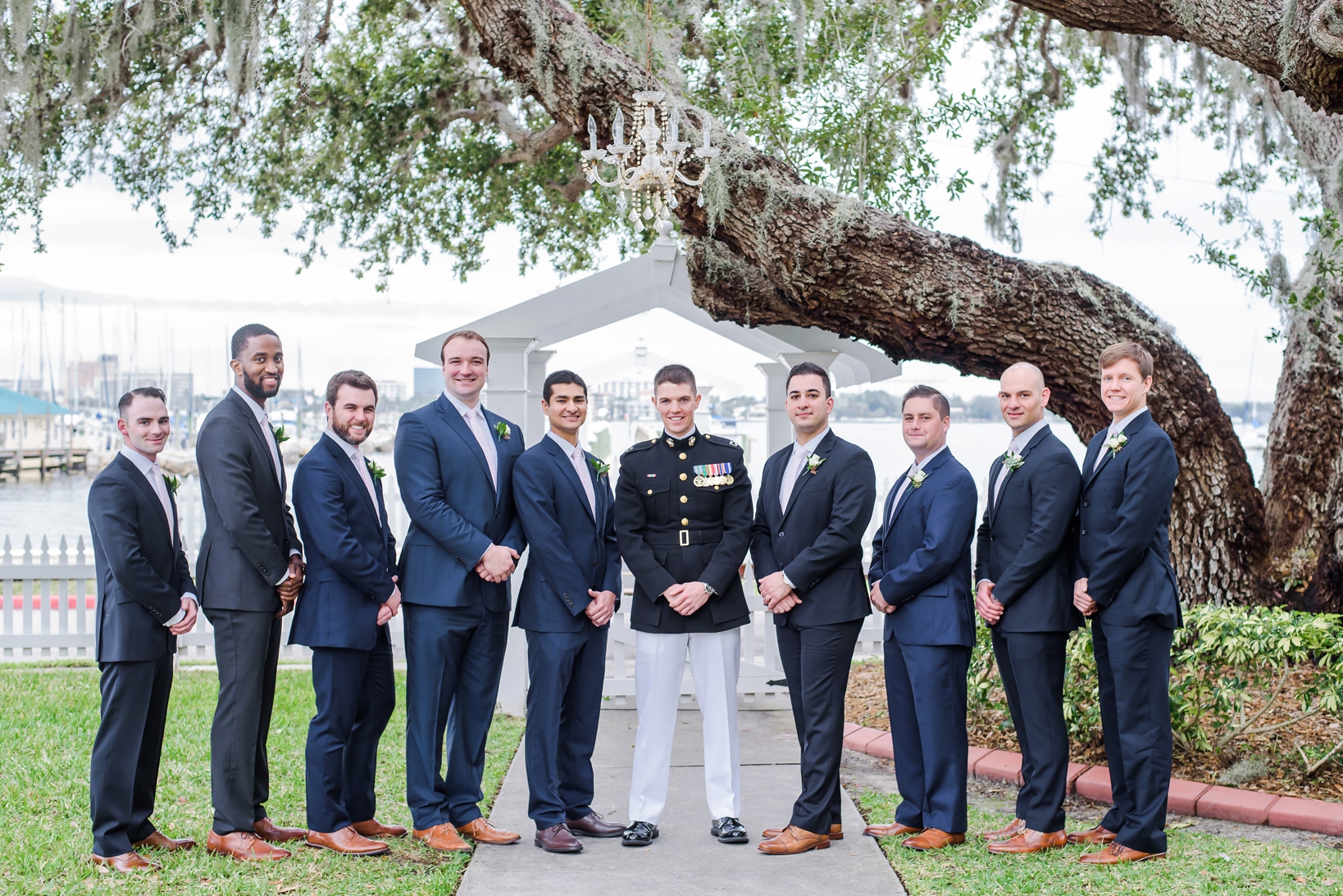 Groom and his Groomsmen under an oak tree by Sarah & Ben Photography