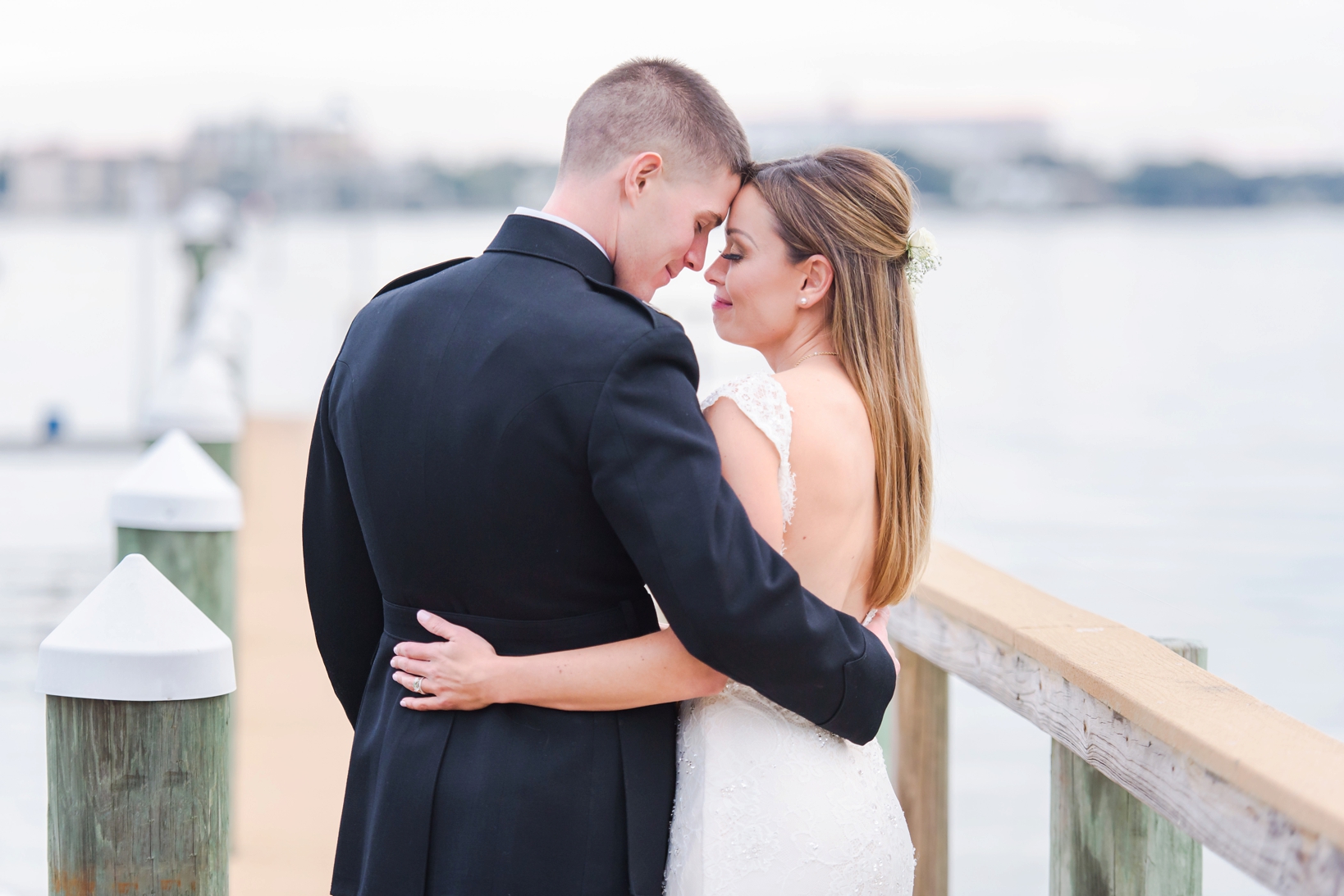 Bride and Groom sharing a quiet moment on the dock of the Palmetto Riverside BnB