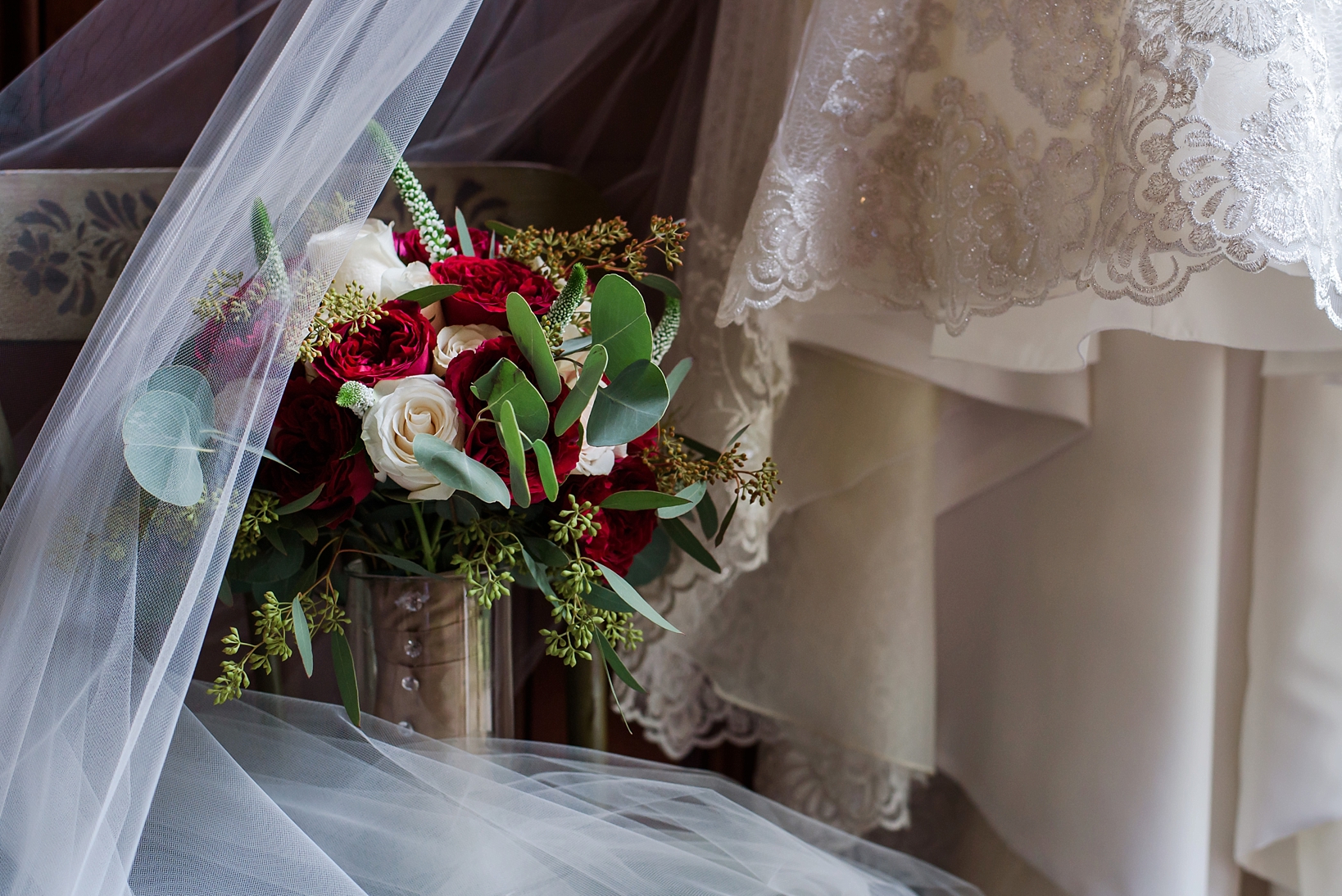 The Bride's full floral bouquet with a hint of the wedding dress in Dunedin, Fl's Anderson Memorial Chapel