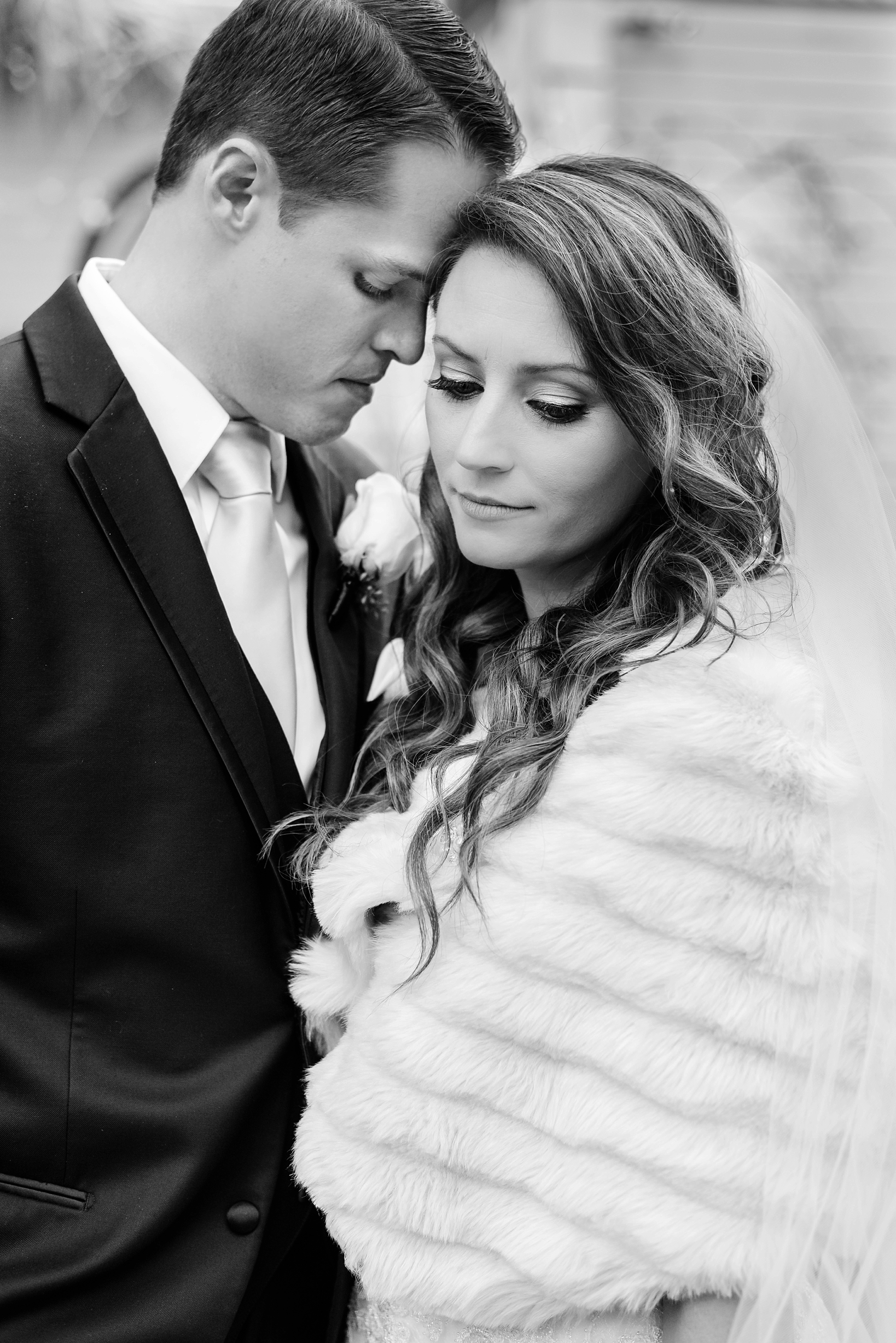 Bride and Groom share a quiet moment in black and white by Sarah & Ben Photography. 