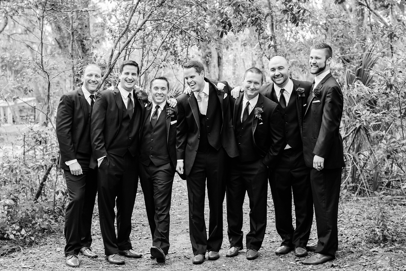Groom and his Groomsmen sharing a laugh after the wedding ceremony by Sarah & Ben Photography. Check out all our work at www.sarahben.com