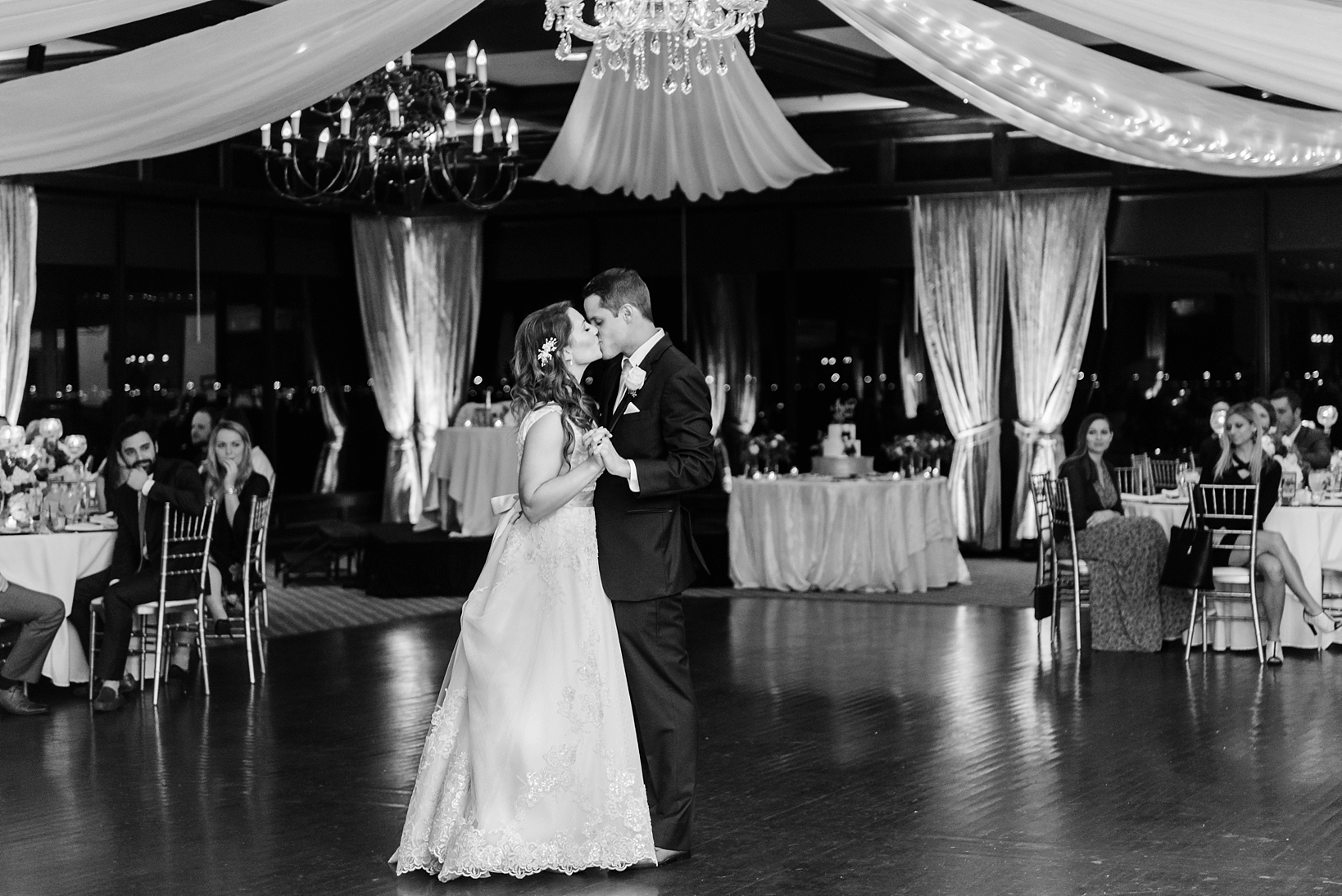 First dance between the bride and groom in the main ballroom of the Rusty Pelican Tampa by Sarah & Ben Photography. 