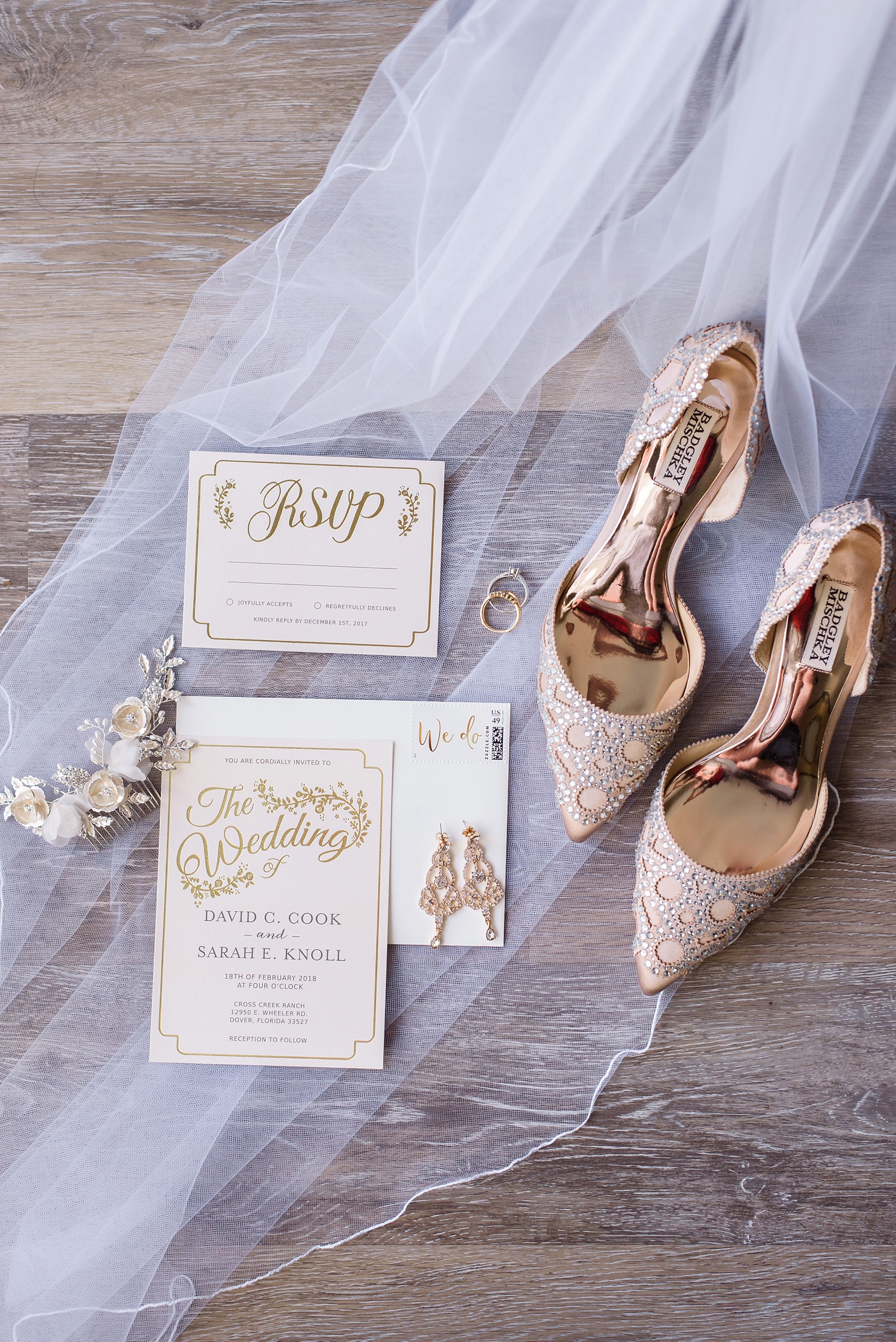 Bridal shoes on a hardwood floor surrounded by the bride's veil