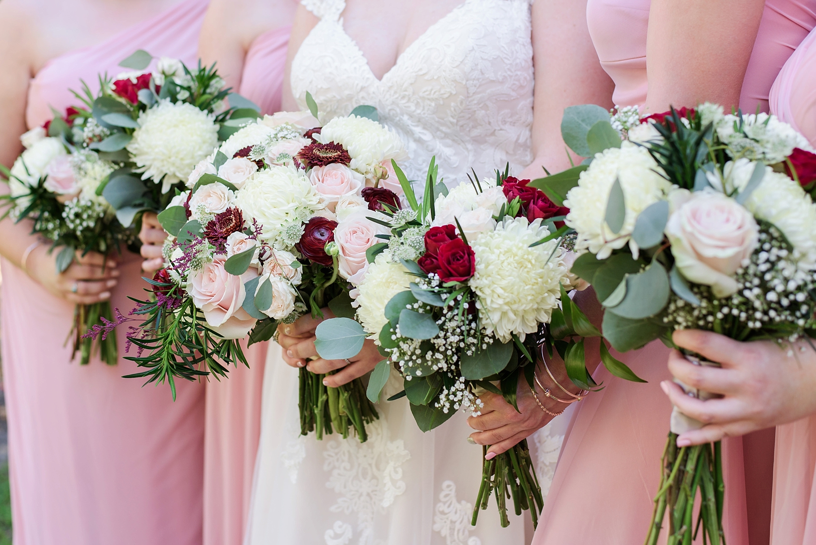 The wedding bouquets with blush and white dresses