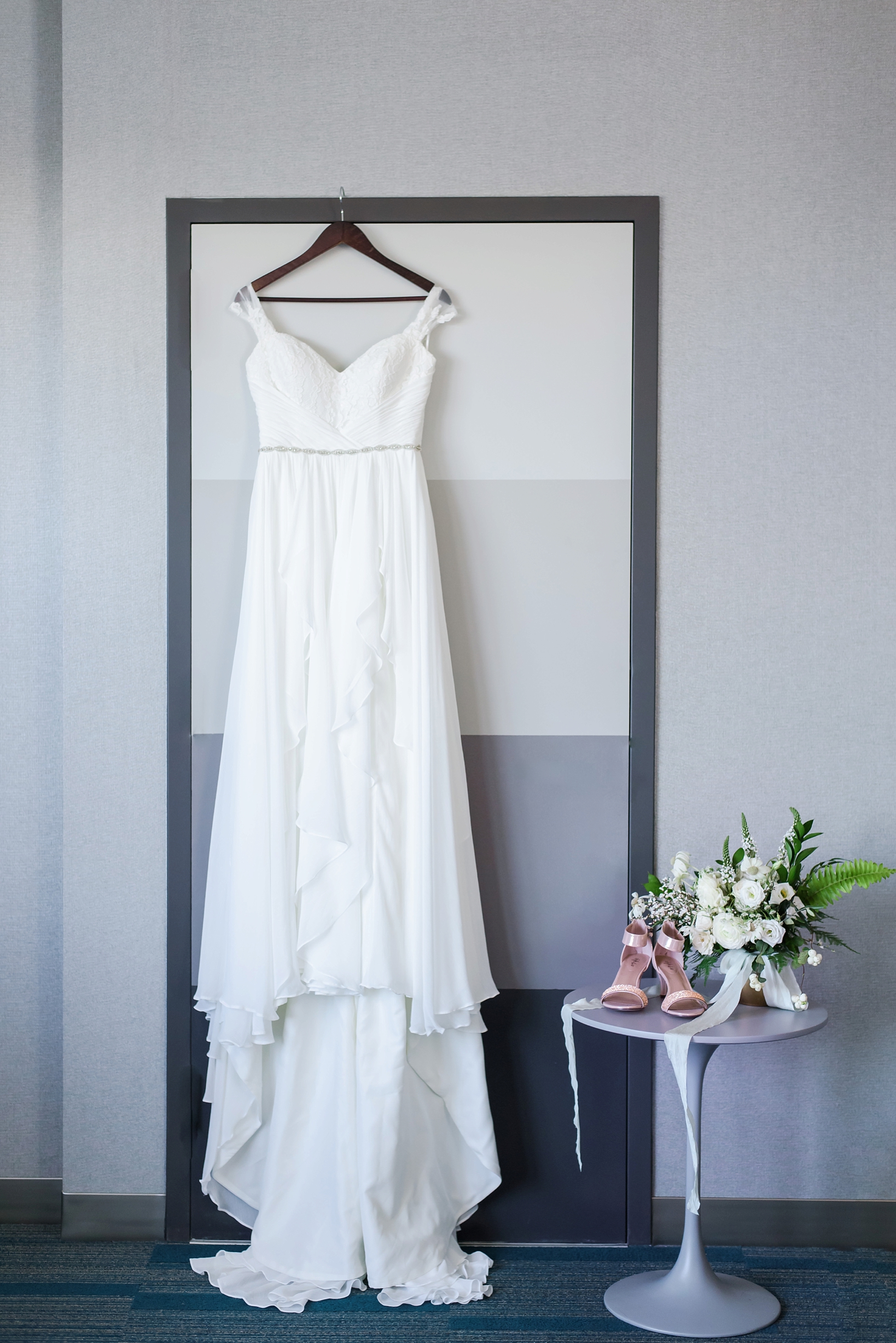 The wedding dress and the shoes with bridal bouquet