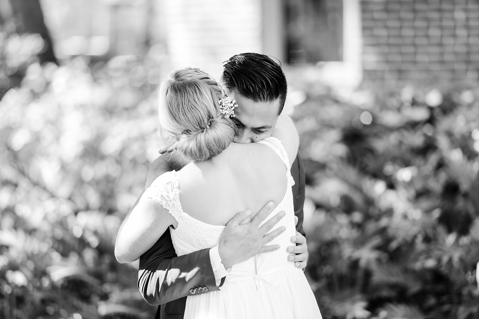 Bride and groom hug for the first time after their first look on the wedding day