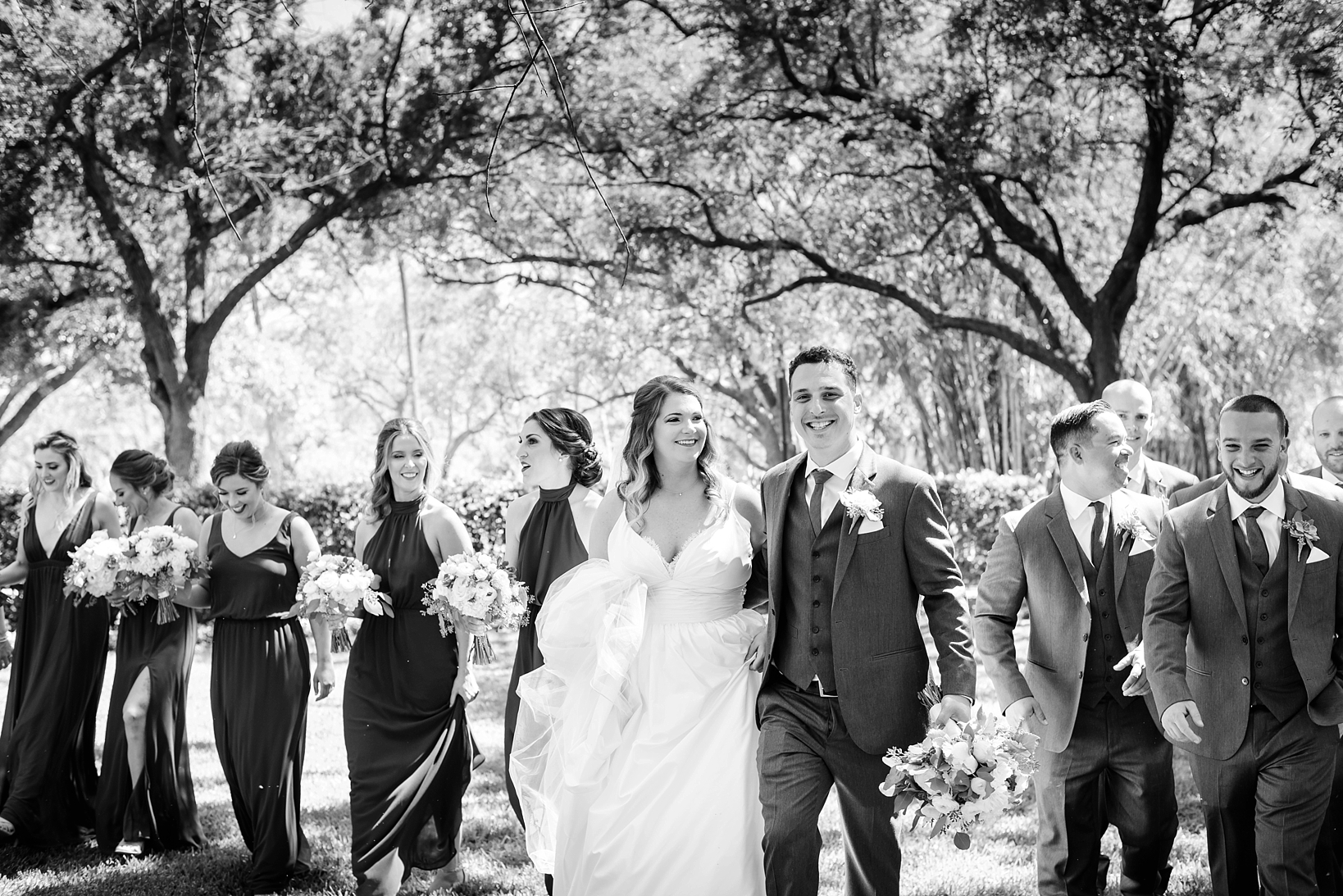 Bride and Groom with their wedding party in black and white