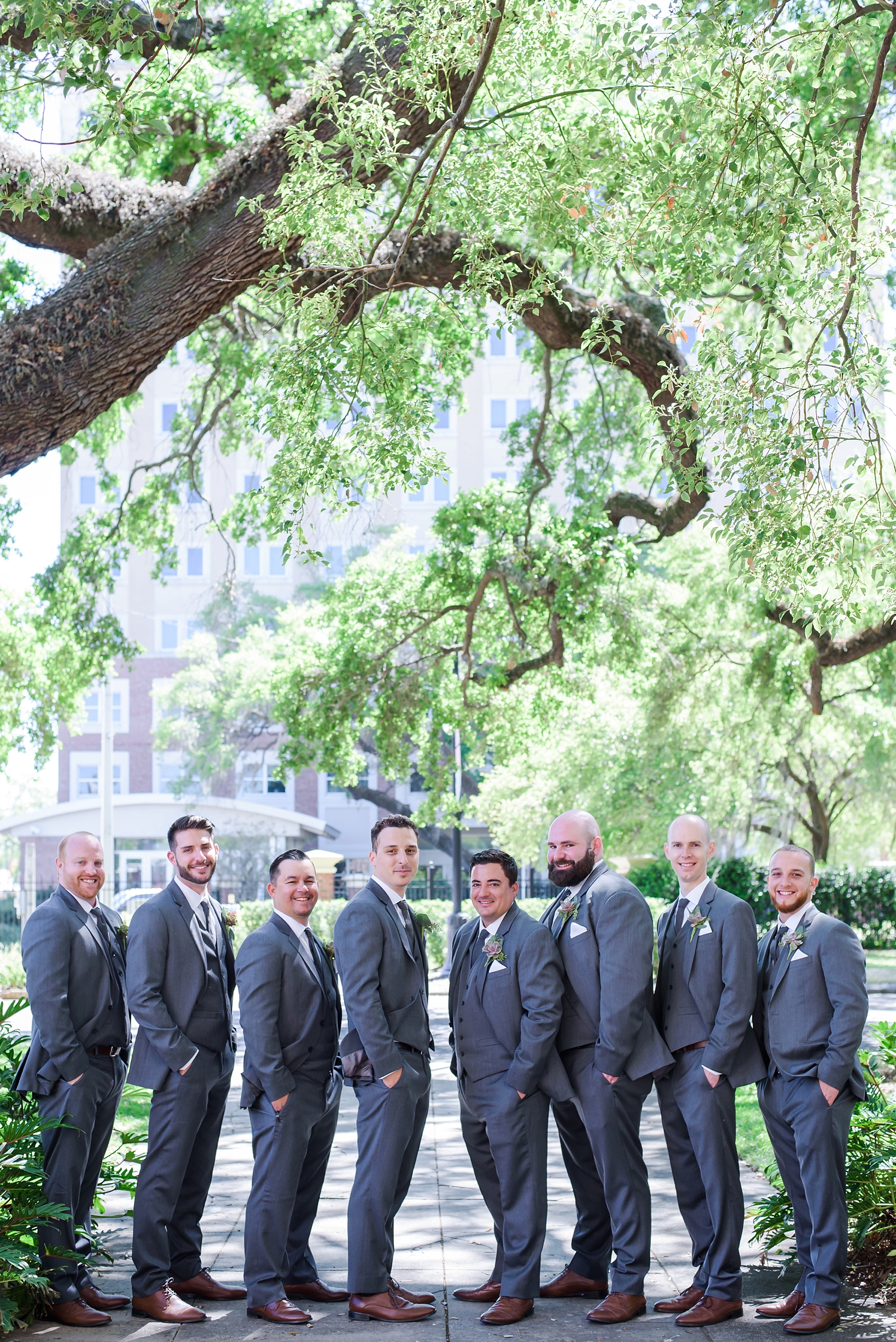 Groom with his groomsmen on the University of Tampa campus in Tampa, FL
