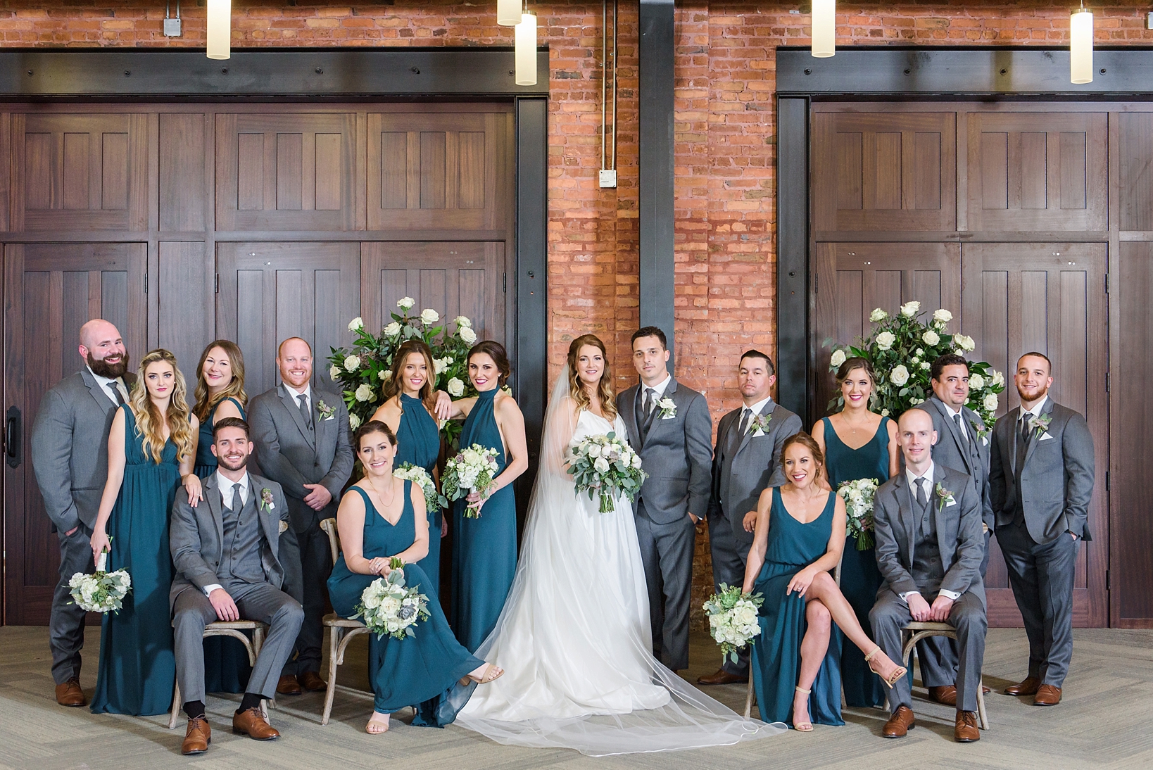 The bridal party in dark tones at Armature Works in Tampa, FL by Sarah & Ben Photography