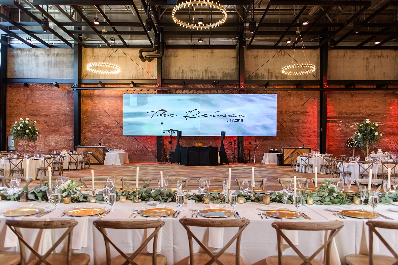 The reception space at Armature Works filled with brick and modern industrial accents by Sarah & Ben Photography