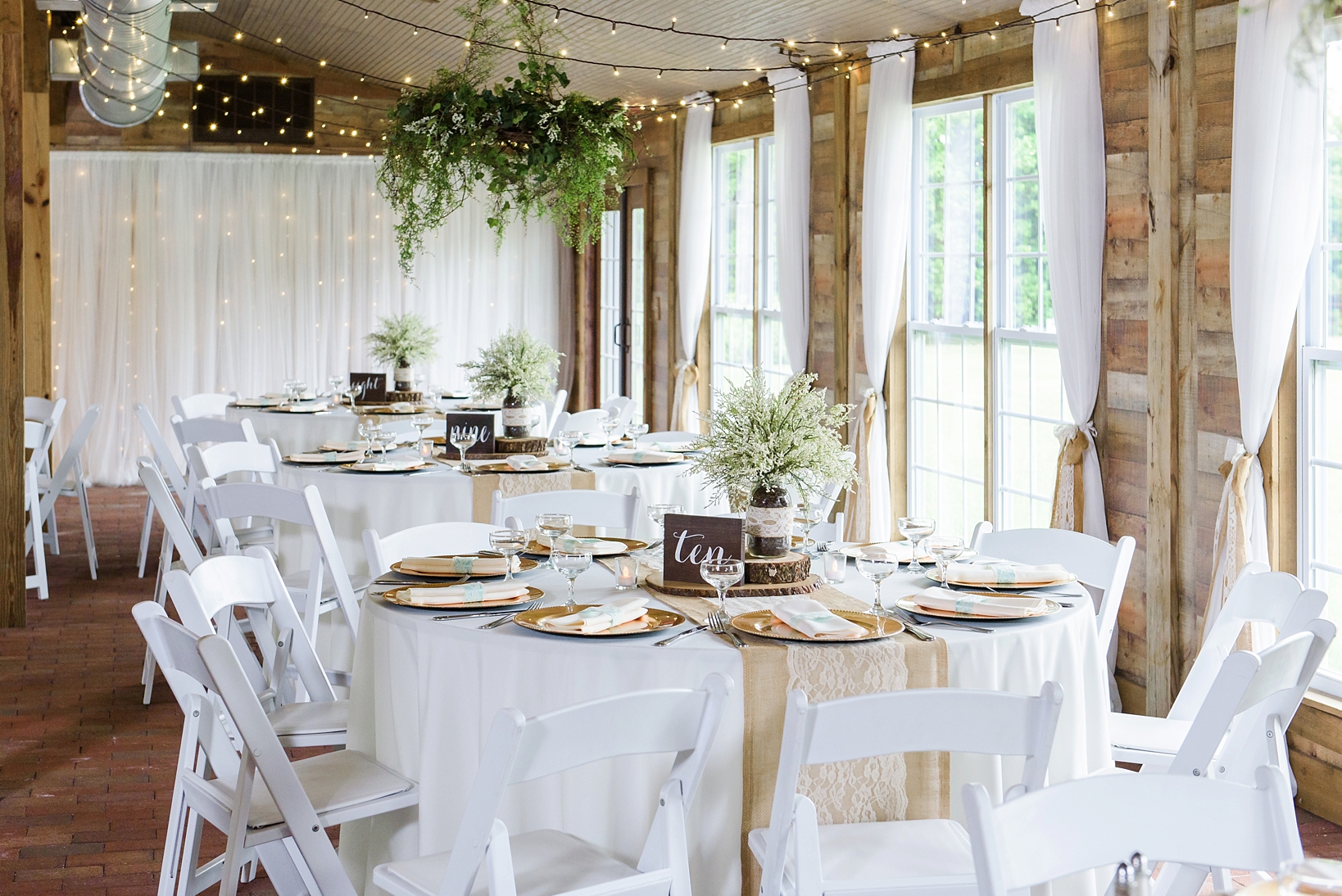Rustic Florida cross creek ranch reception with gold and green accents in Seffner, FL