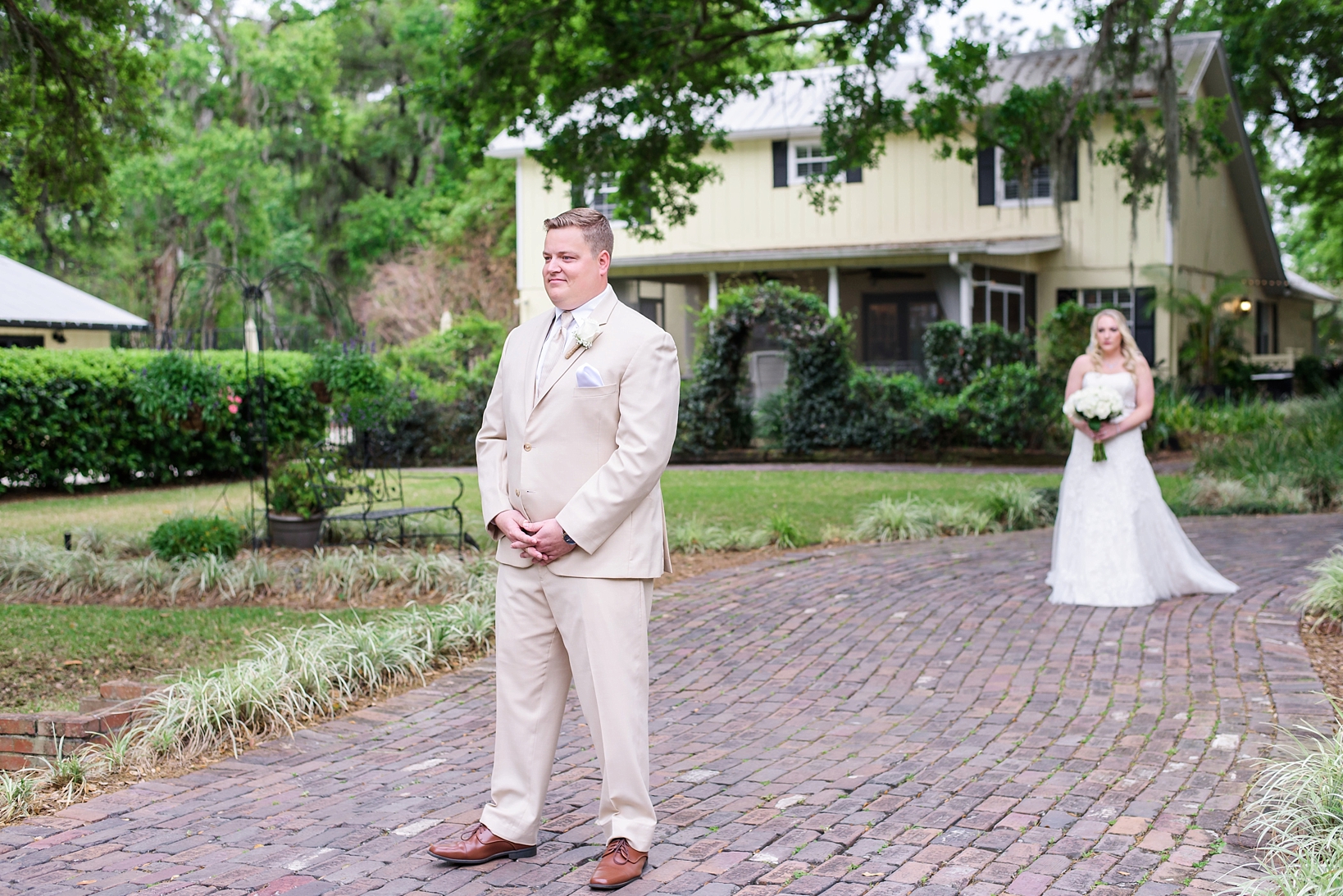 The groom waiting patiently for his bride to arrive for their first look at cross creek ranch