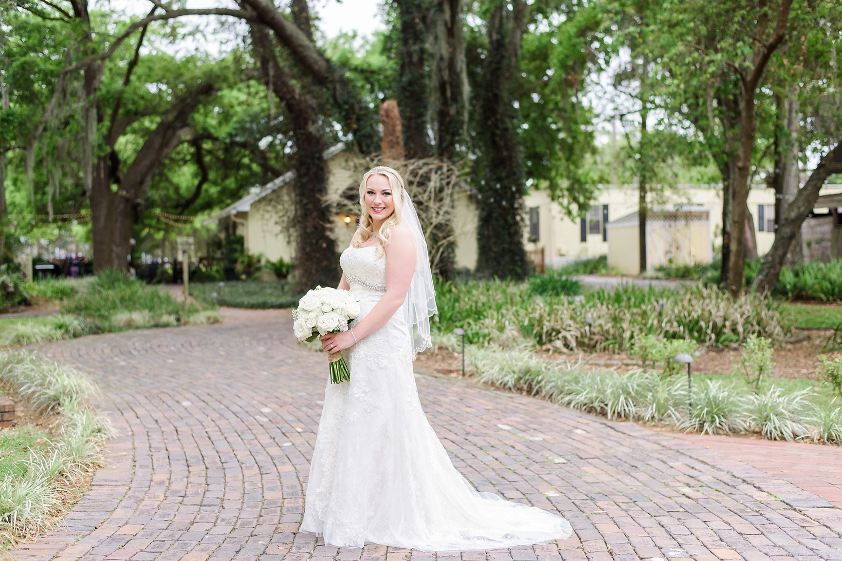 The bride posing on a brick path at cross creek ranch in florida