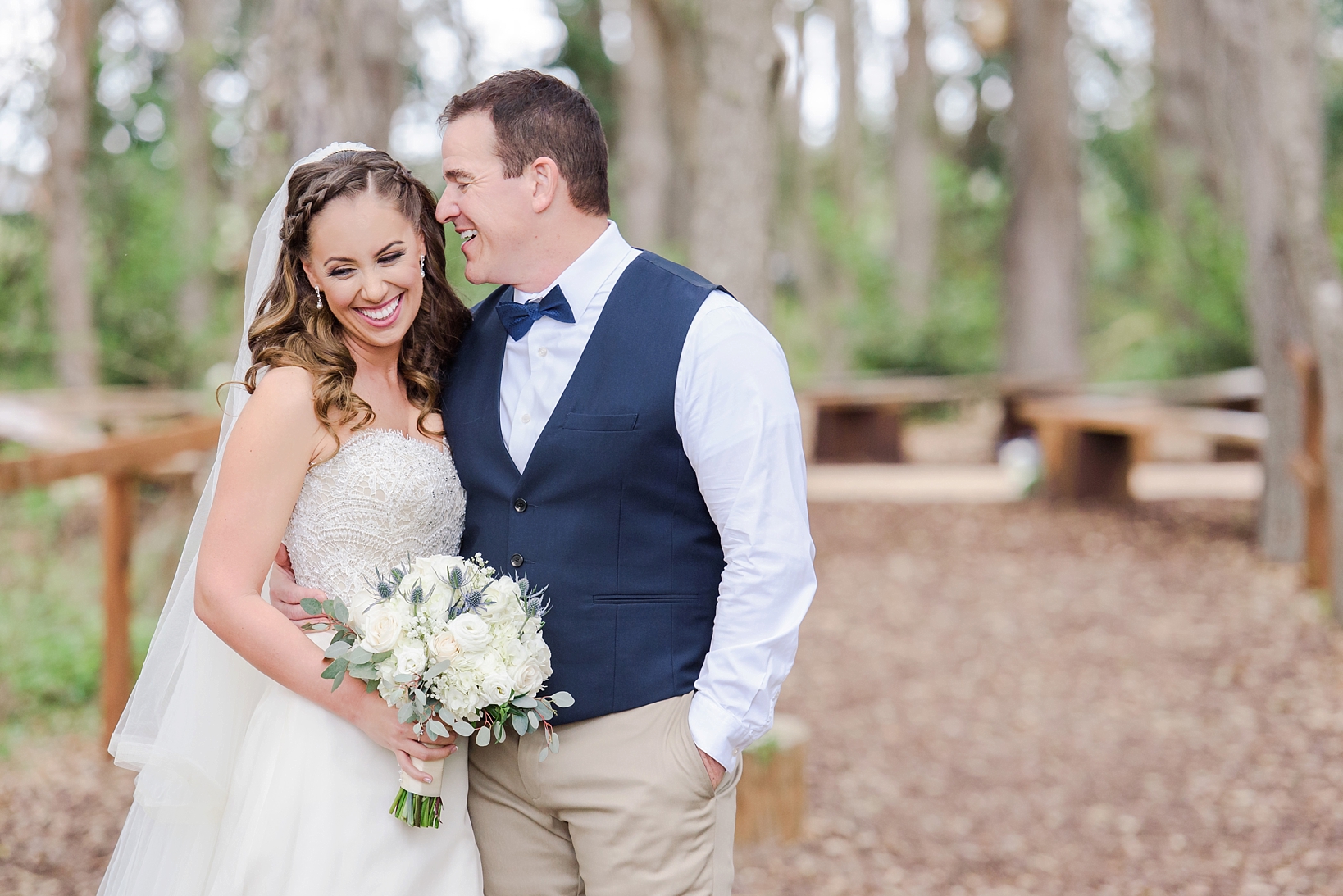 Bride and Groom laugh during portraits by Sarah & Ben Photography