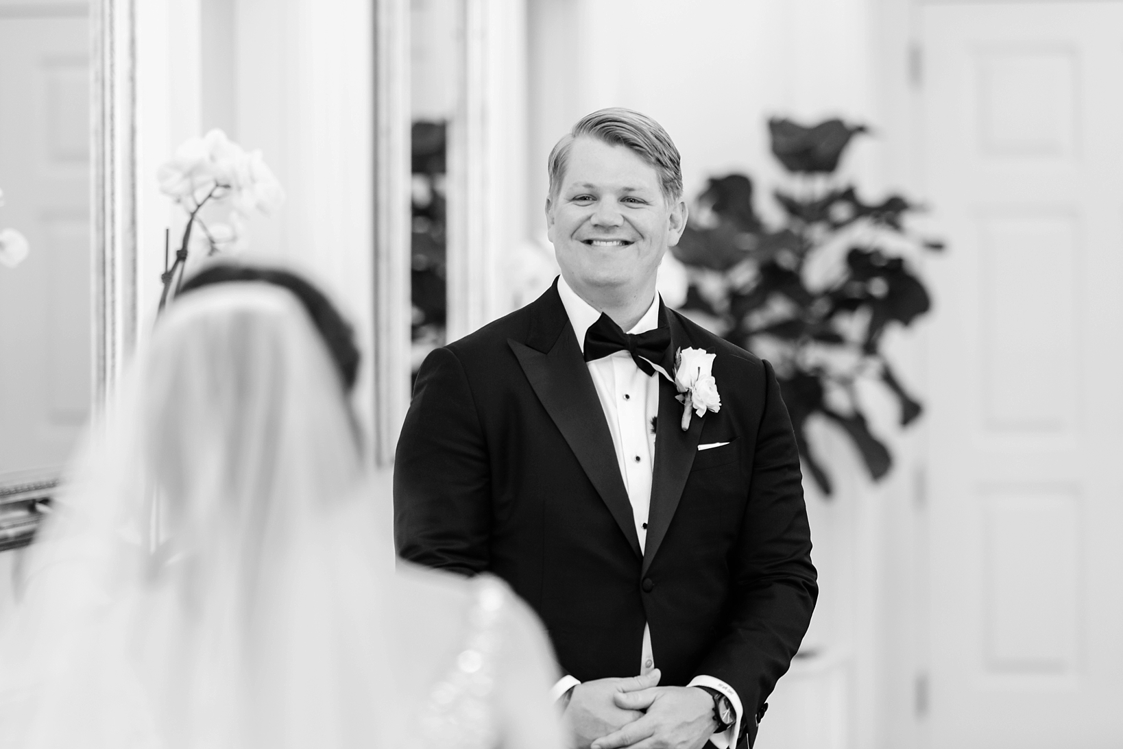 Groom smiling as he sees his Bride for the first time by Sarah & Ben Photography