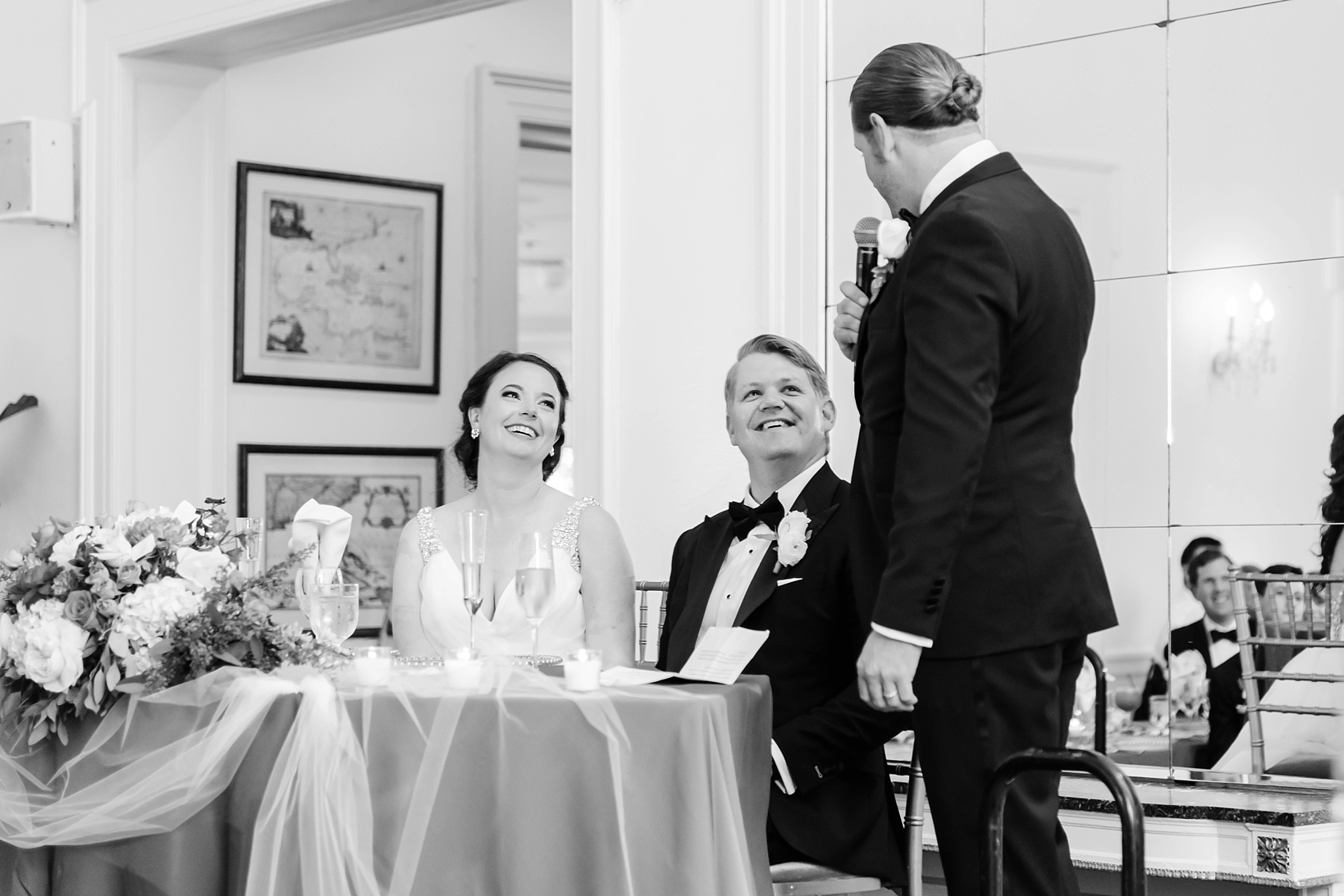 Best man giving his toast to the bride and groom in the Tampa Yacht Club by Sarah & Ben Photography