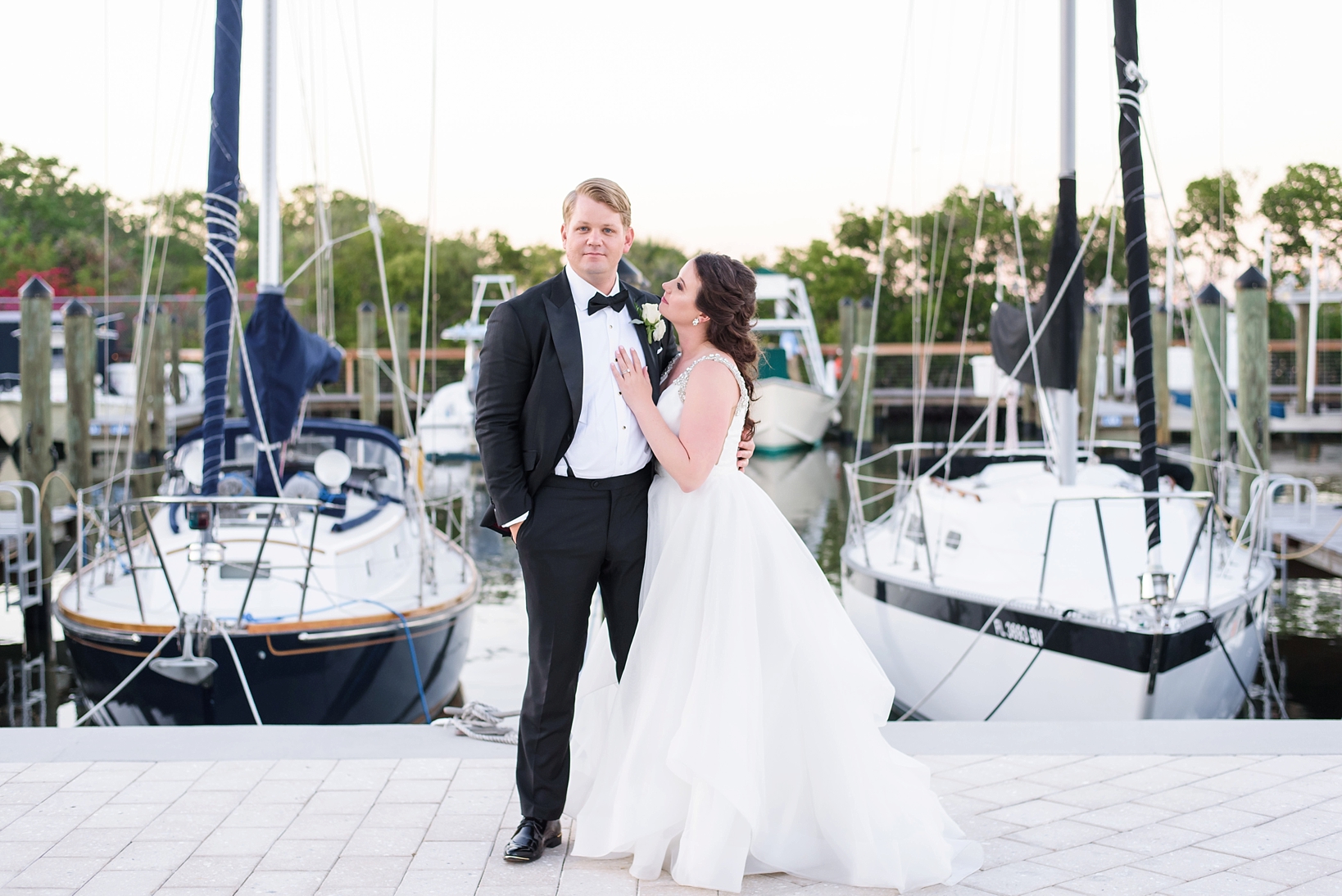 Classic portrait of the bride and groom in the docks of the Tampa Bay Yacht and Country Club by Sarah & Ben Photography