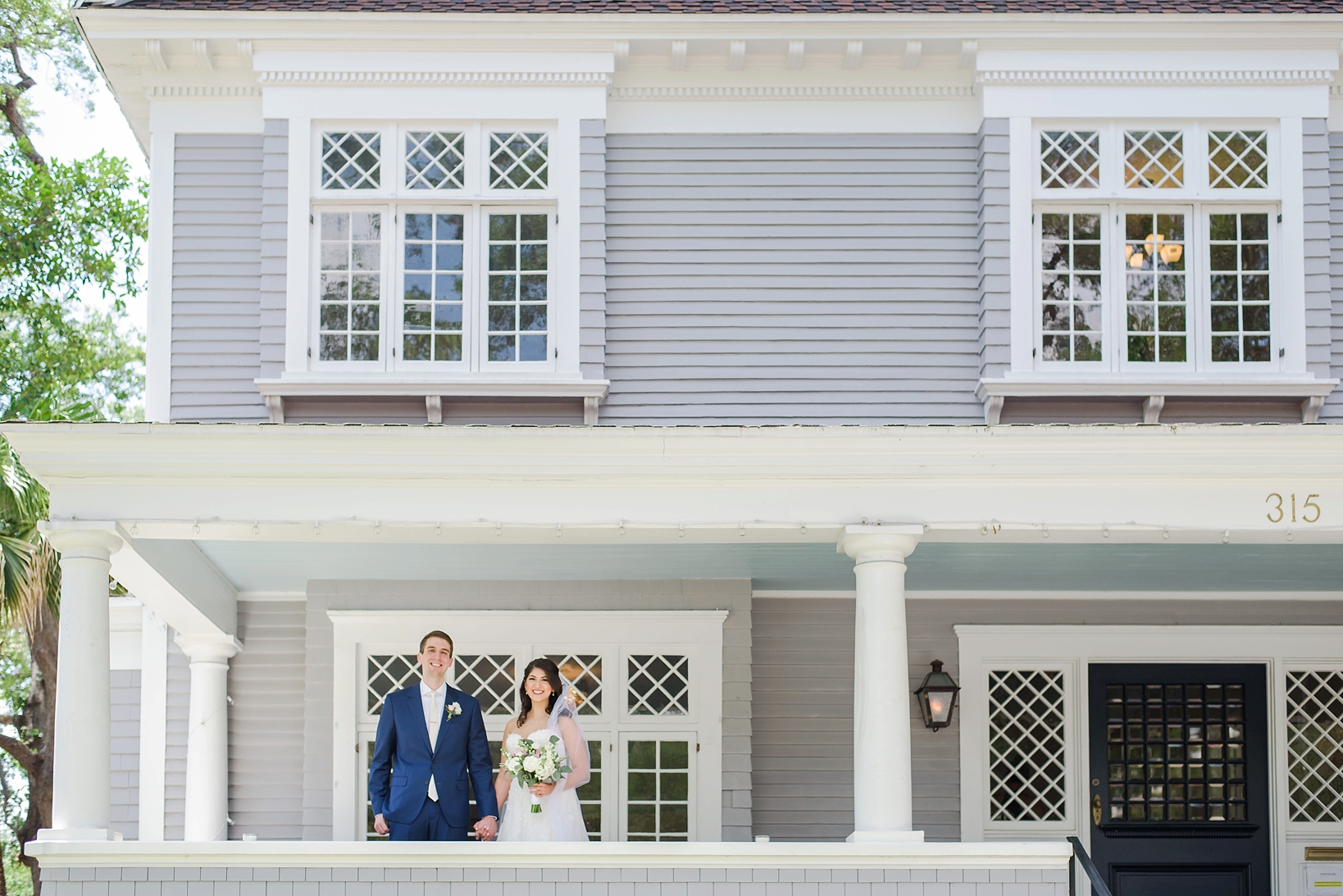 Bride and groom on the porch of the Orlo Wedding venue in Tampa, FL