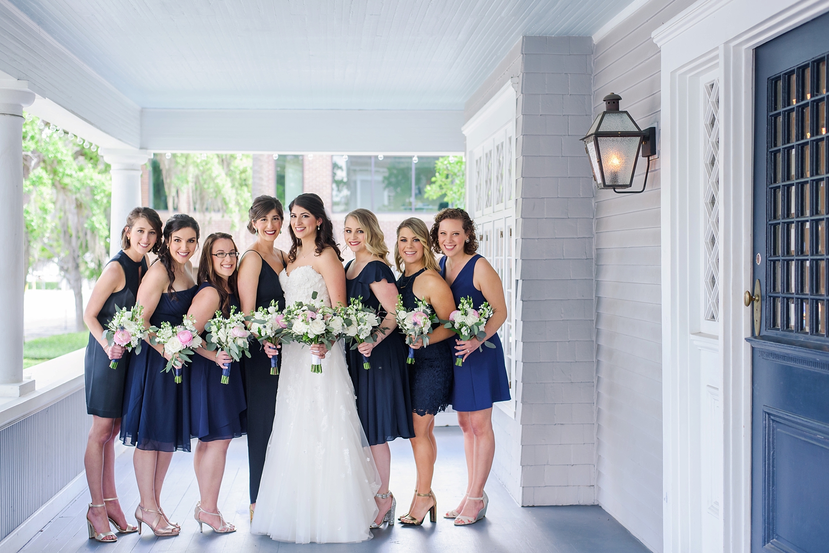 The Bride and the Bridesmaids on the front porch of the Orlo in Tampa, Fl