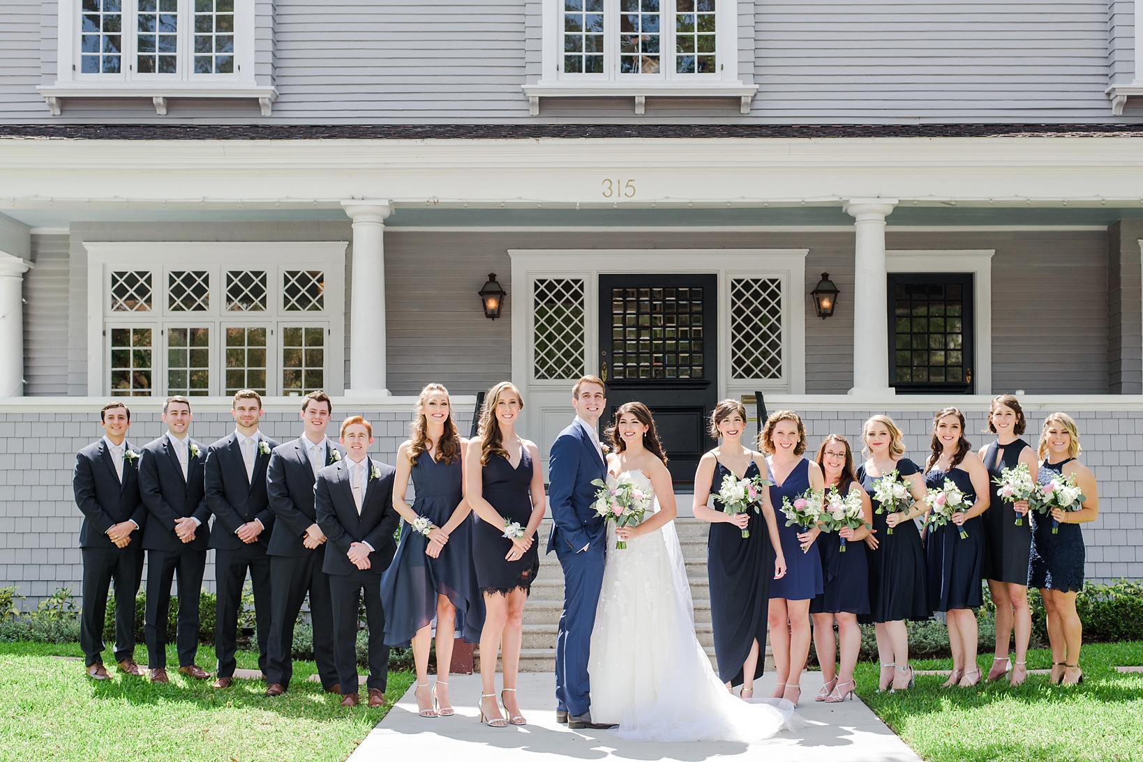 The entire wedding party in front of the Orlo in Tampa, Florida