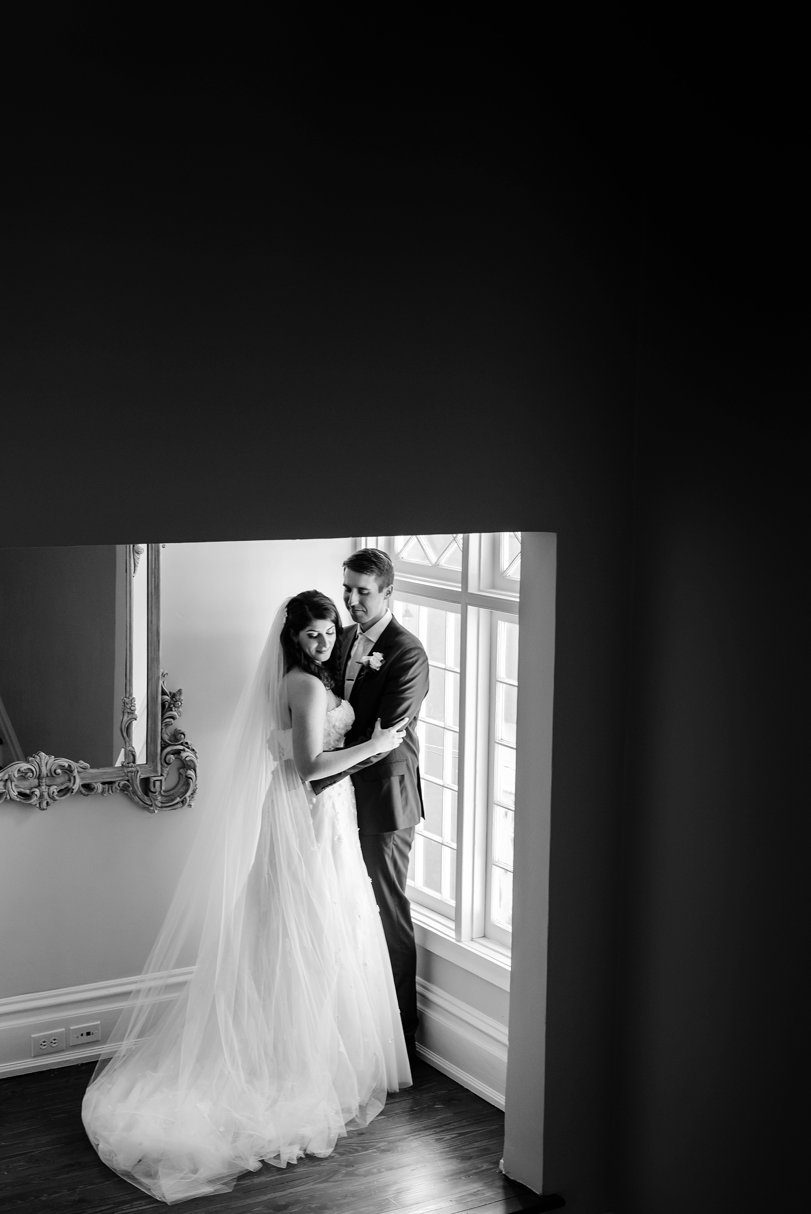 Bride and Groom in timeless black and white with asymmetrical framing 