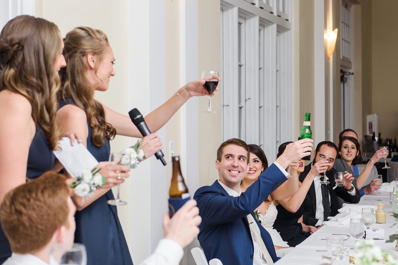 The grooms sisters give a toast during the wedding reception by Sarah & Ben Photography