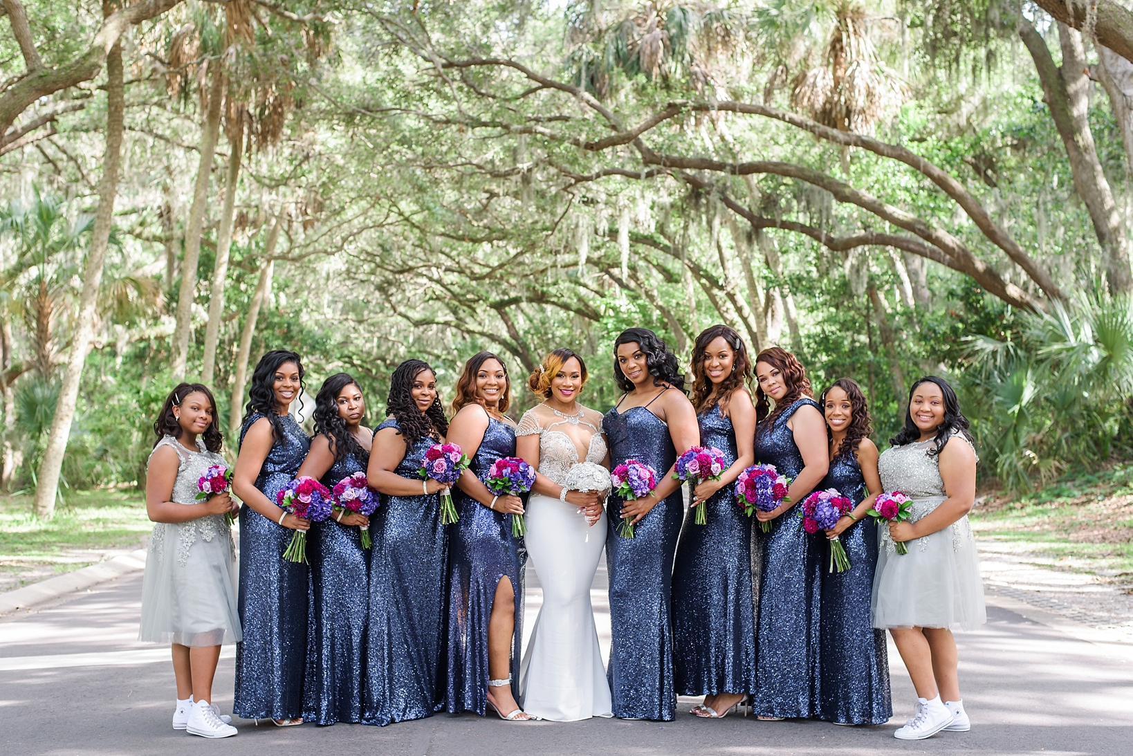 The Bride and her Bridesmaids pose under the giant oak trees of Safety Harbor, FL
