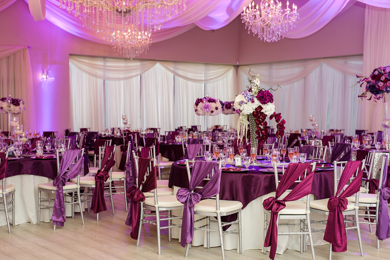The reception space decked out in purples and pink hues