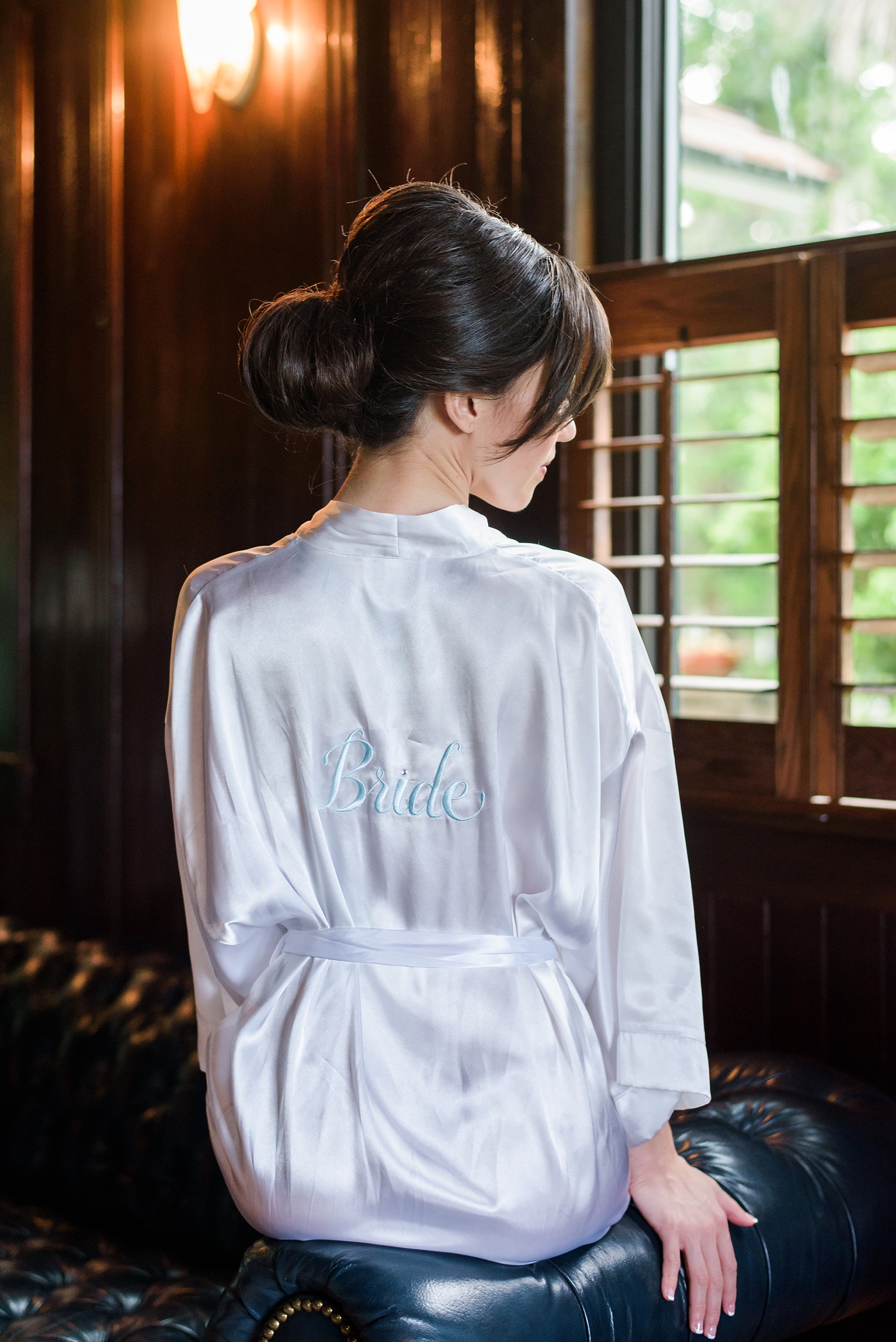 Custom embroidered robe worn by the bride by Sarah & Ben Photography