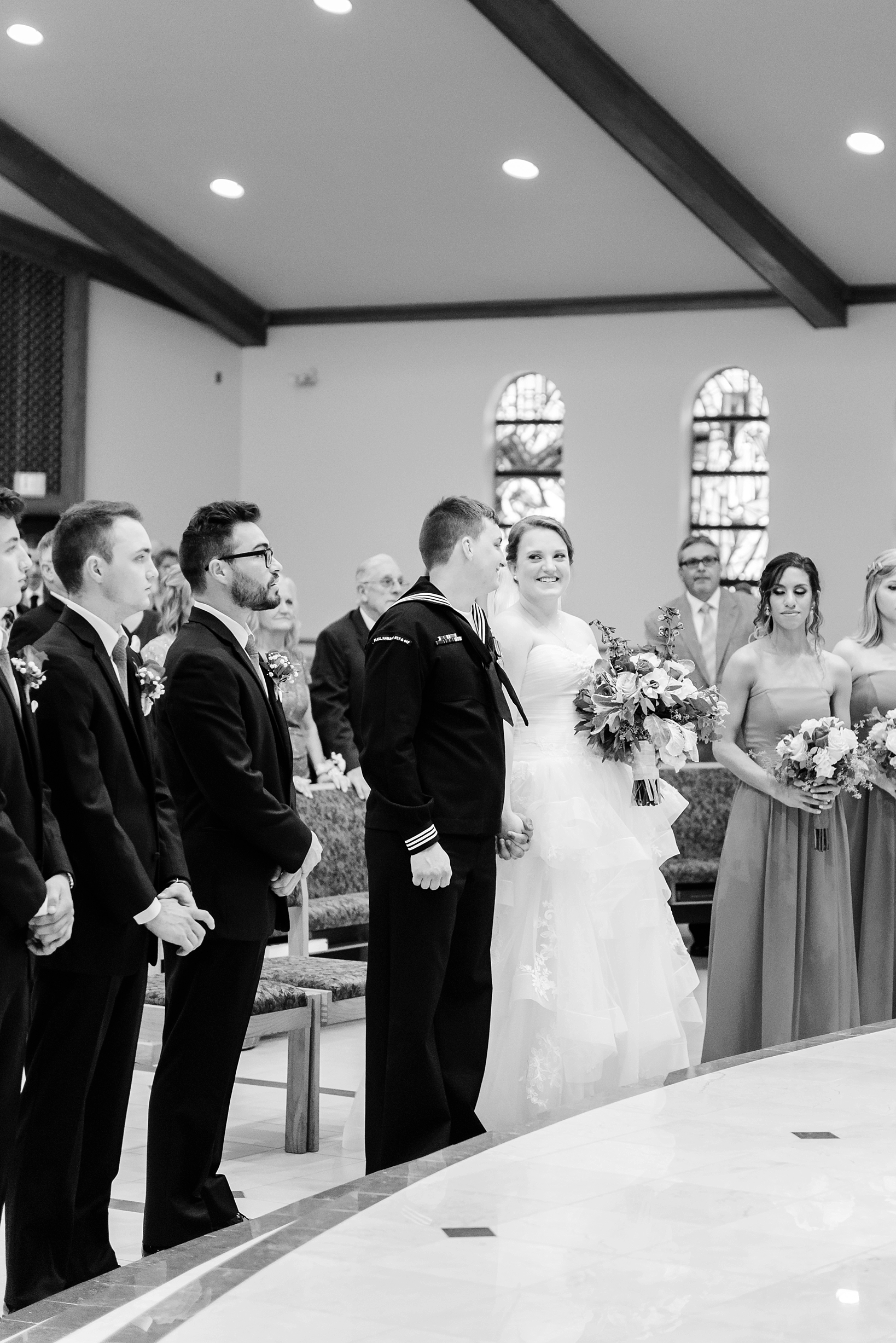 Bride gives her groom a huge smile during their wedding ceremony