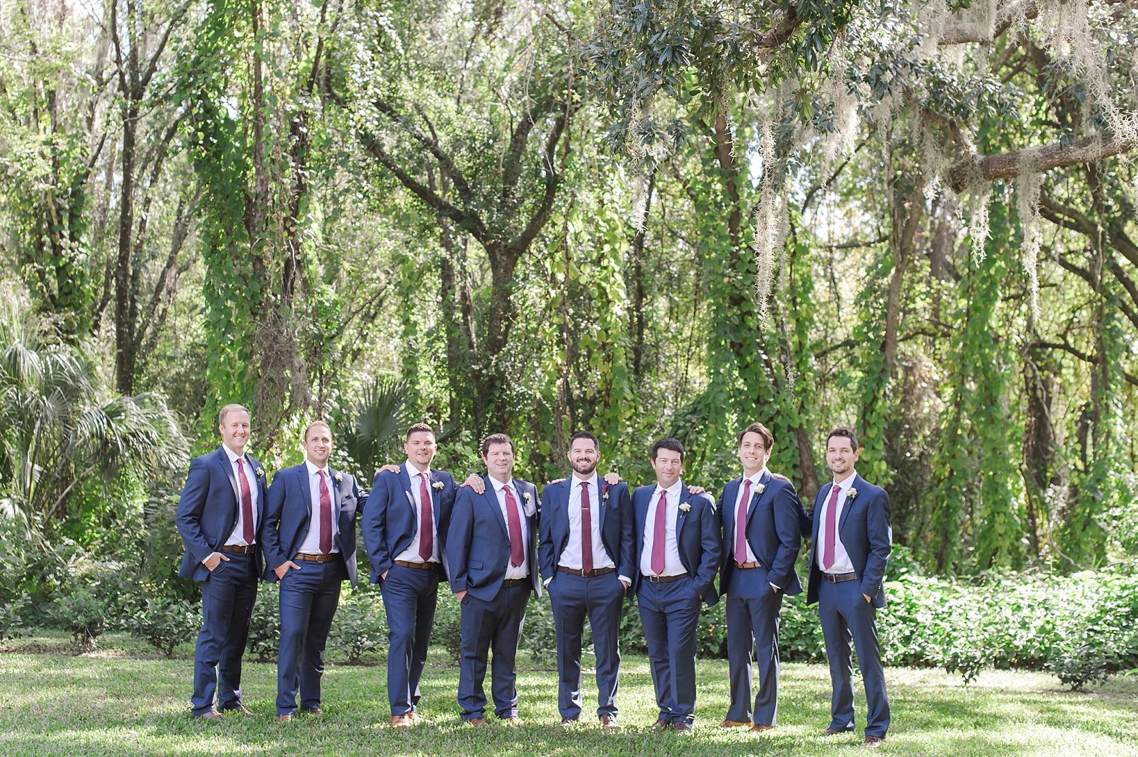 The Groom and his Groomsmen pose surrounded by greenery at Bakers Ranch