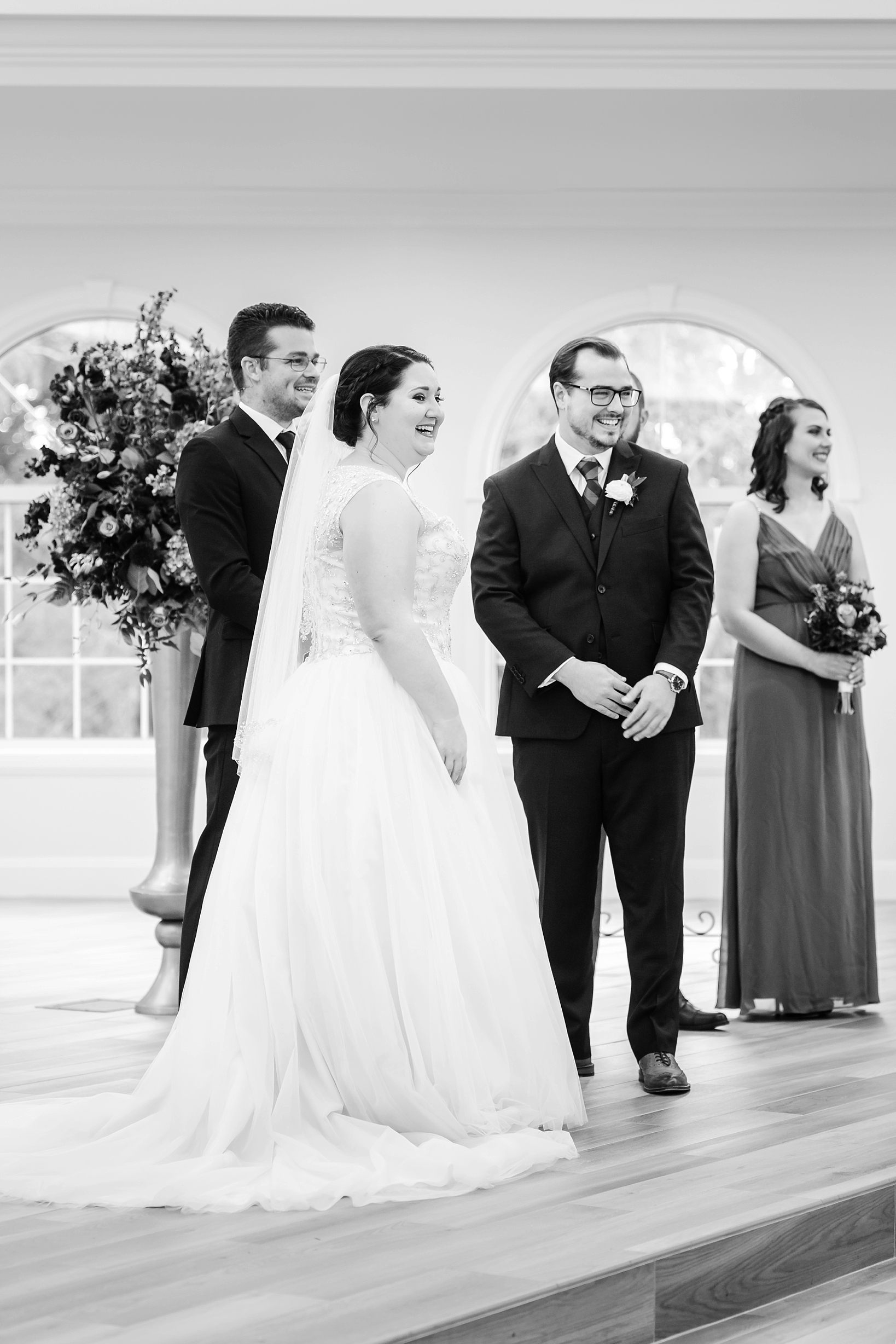 Bride and Groom laughing during their ceremony by Sarah & Ben Photography