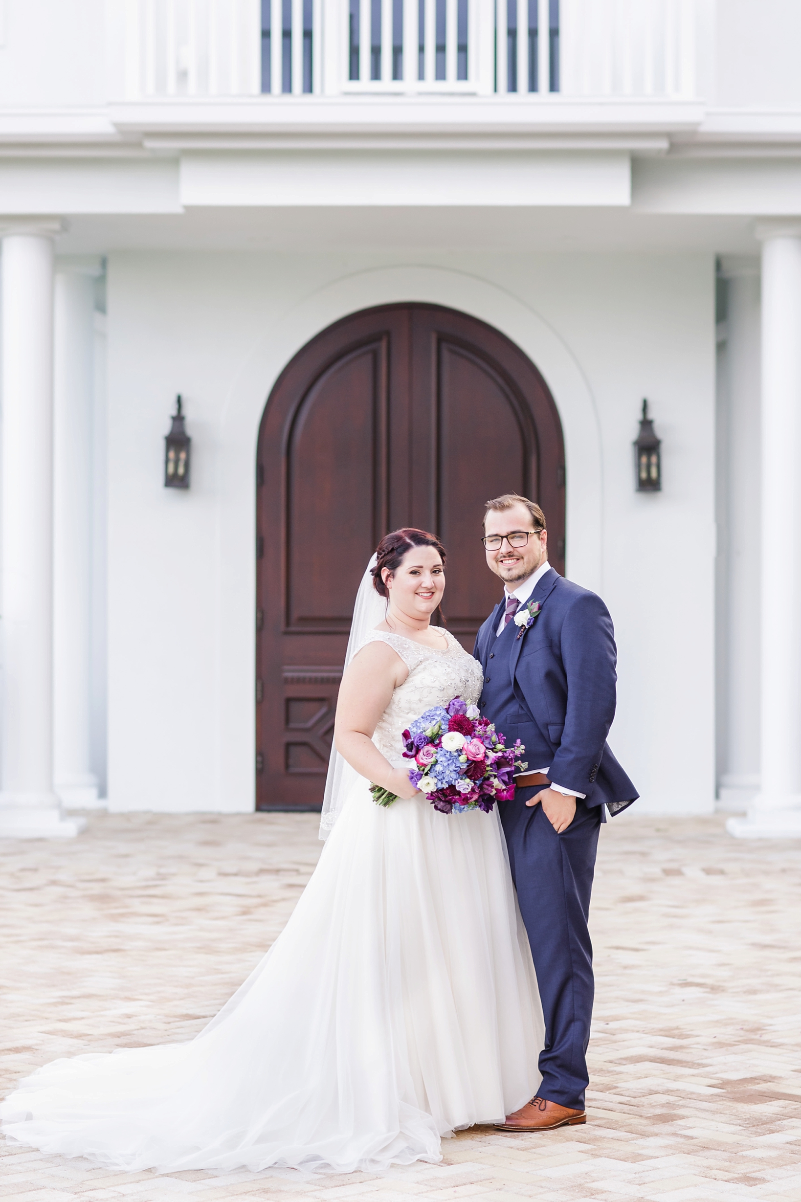 Bride and Groom in a traditional wedding pose by Sarah & Ben Photography