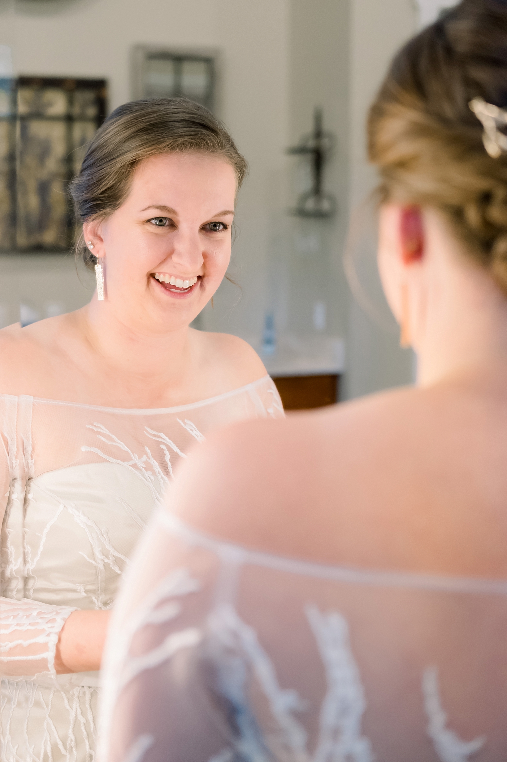 Bride seeing herself in her wedding dress for the first time in Jacksonville, Florida's Bowing Oaks Plantation