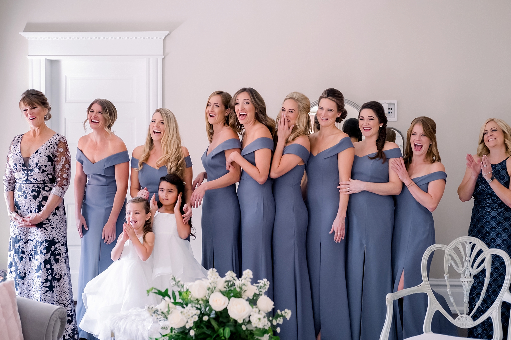 The bridesmaids seeing the bride in her dress for the first time by Sarah & Ben Photography