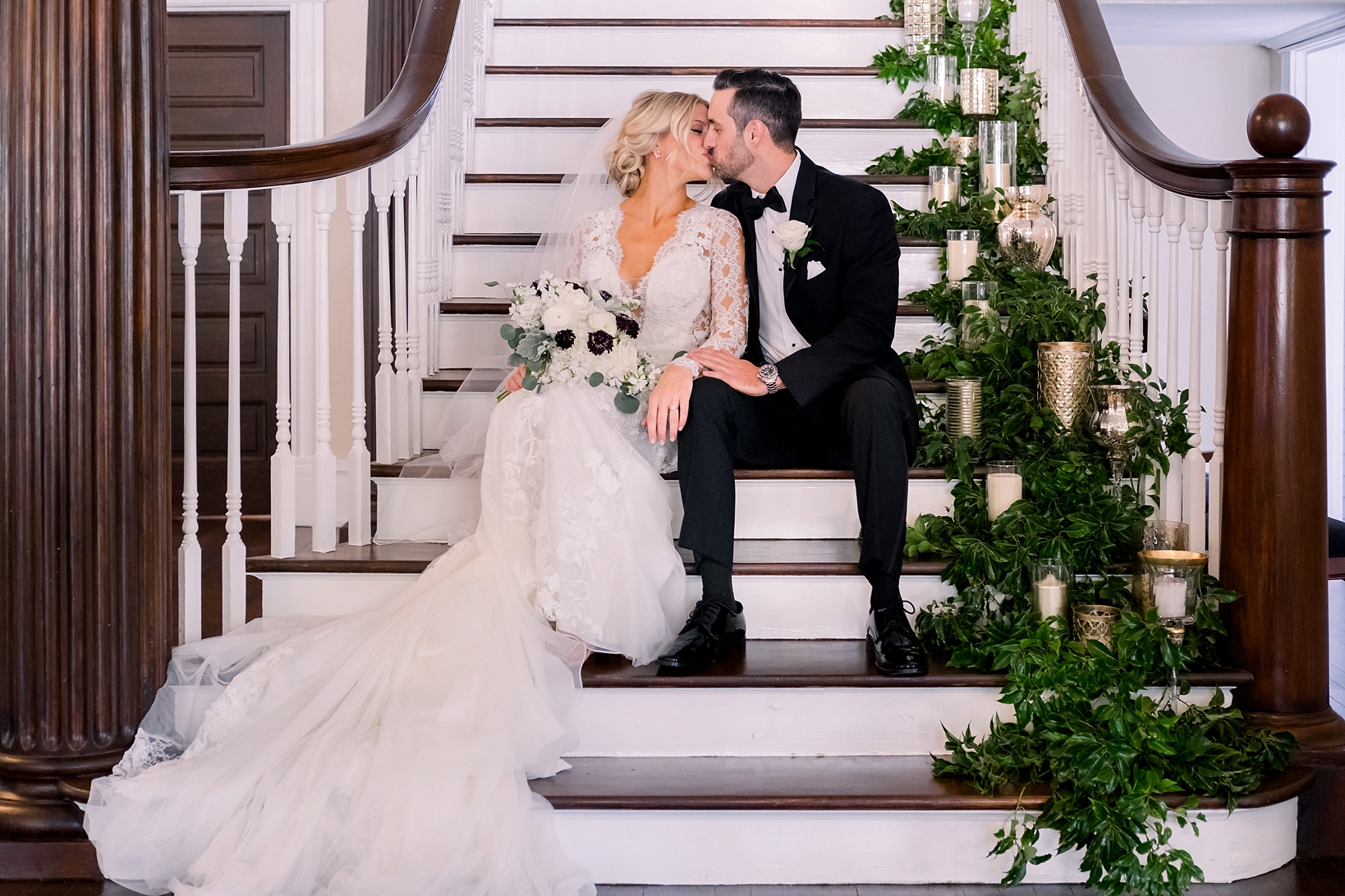 Bride and groom share a kiss on the steps on the oslo in Tampa, Fl