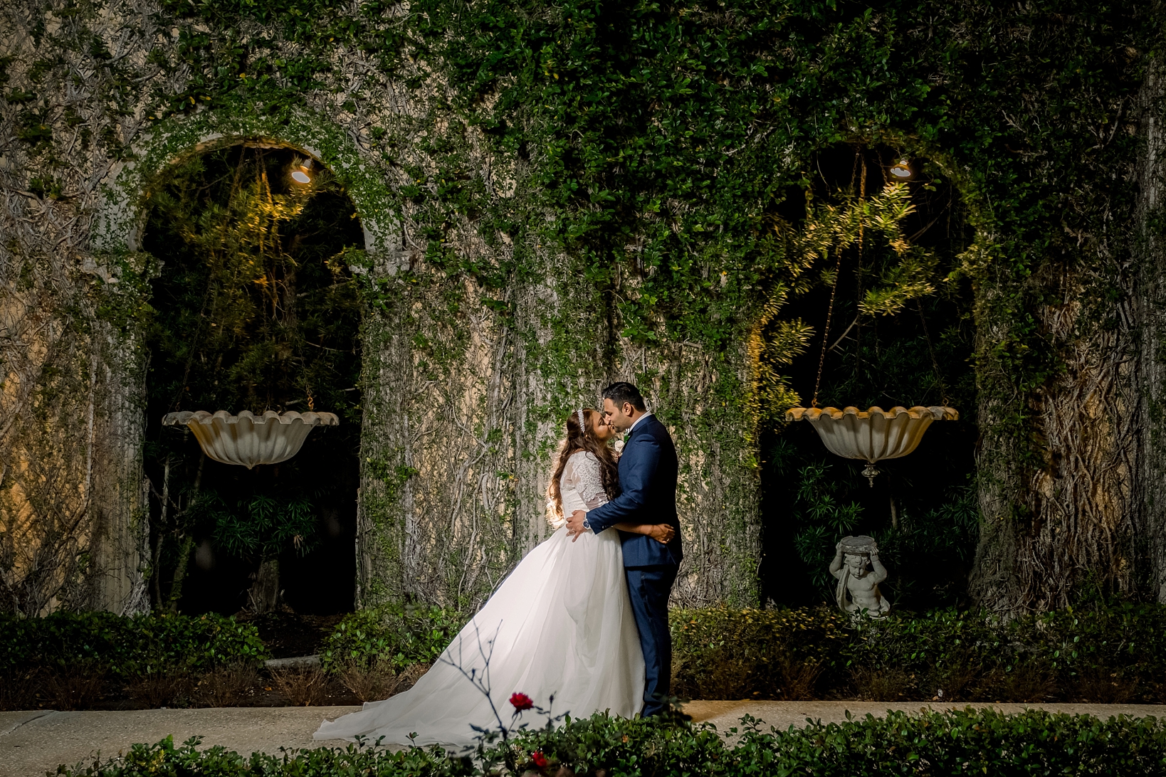 An amazing nighttime portrait against all the lush greenery of the Kapok Tree in Clearwater, FL by Sarah & Ben Photography