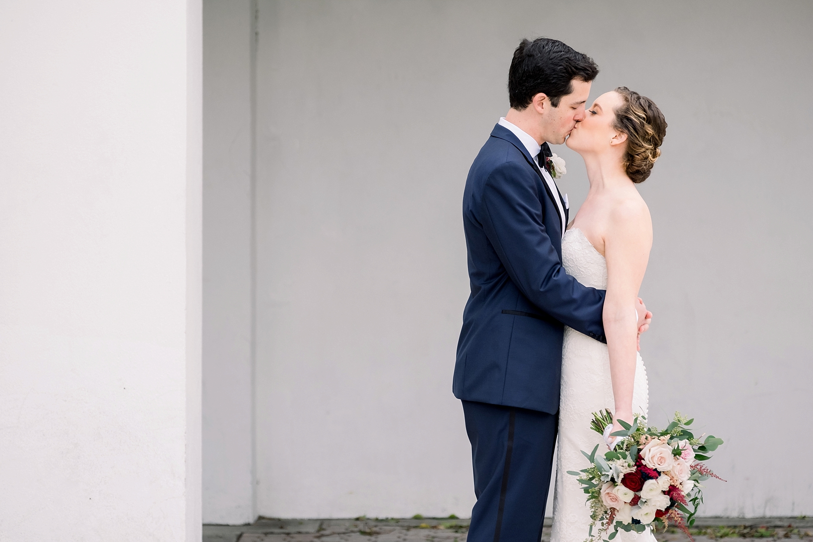The Bride and Groom share an intimate moment by Sarah & Ben Photography