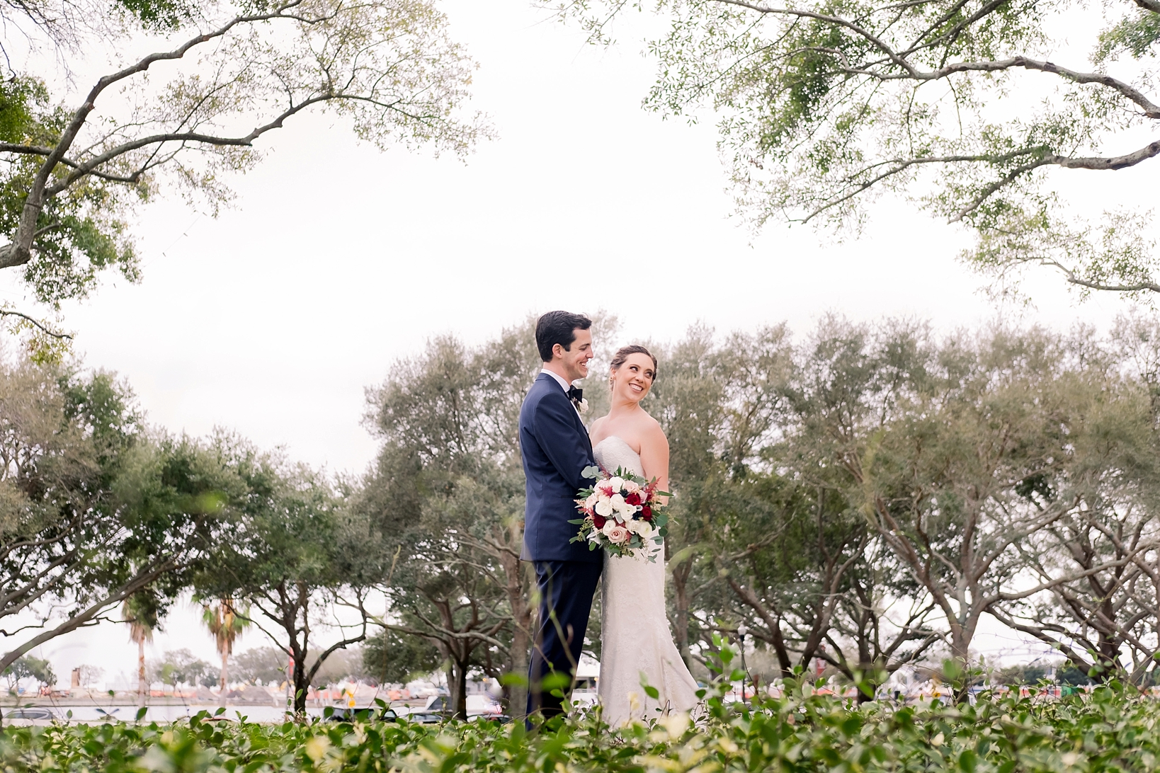 Bridal portraits in St. Pete, Florida surrounded by trees by Sarah & Ben Photography