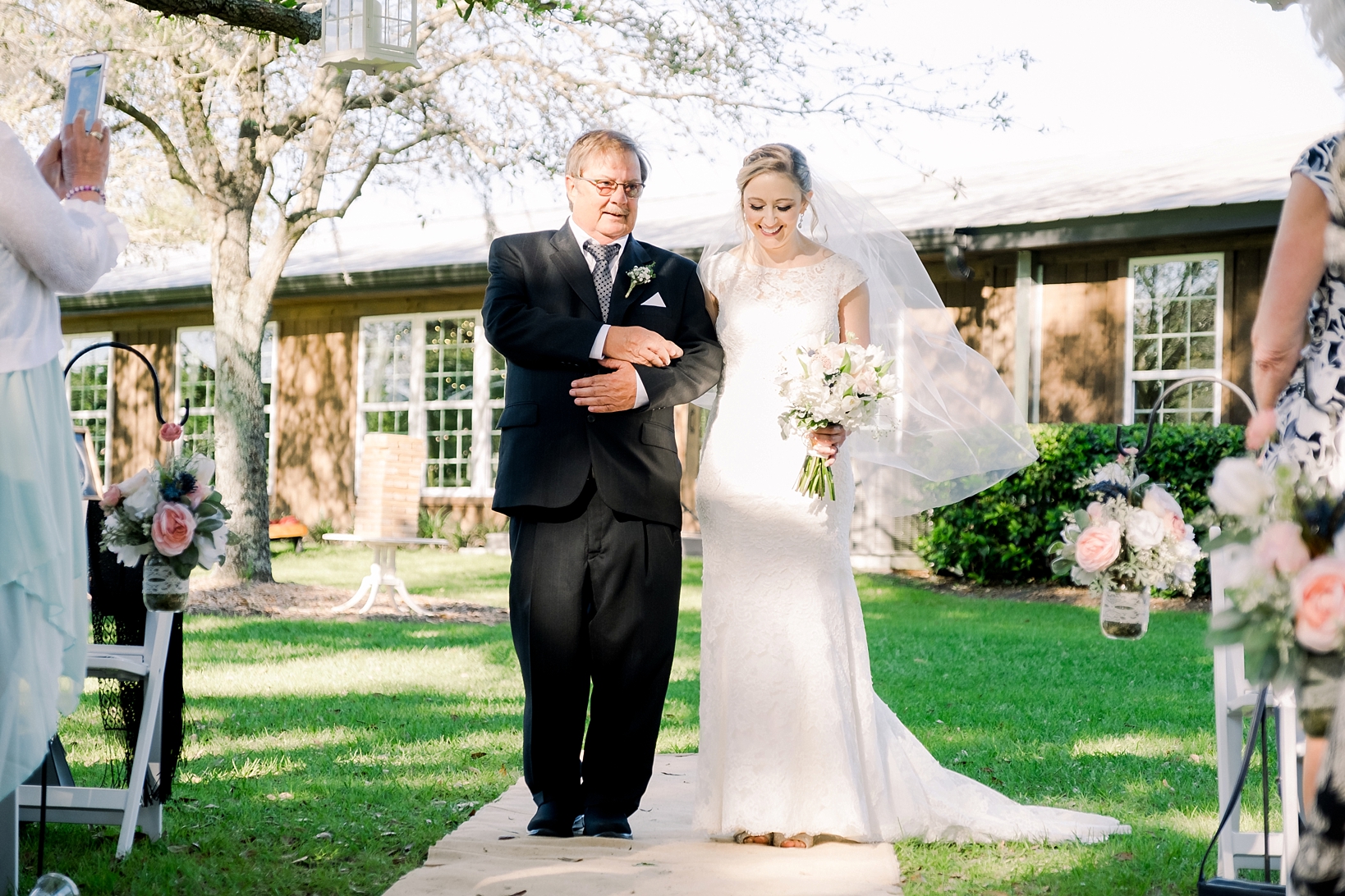 The Bride and her Dad walk down the aisle on her Cross Creek Ranch wedding day