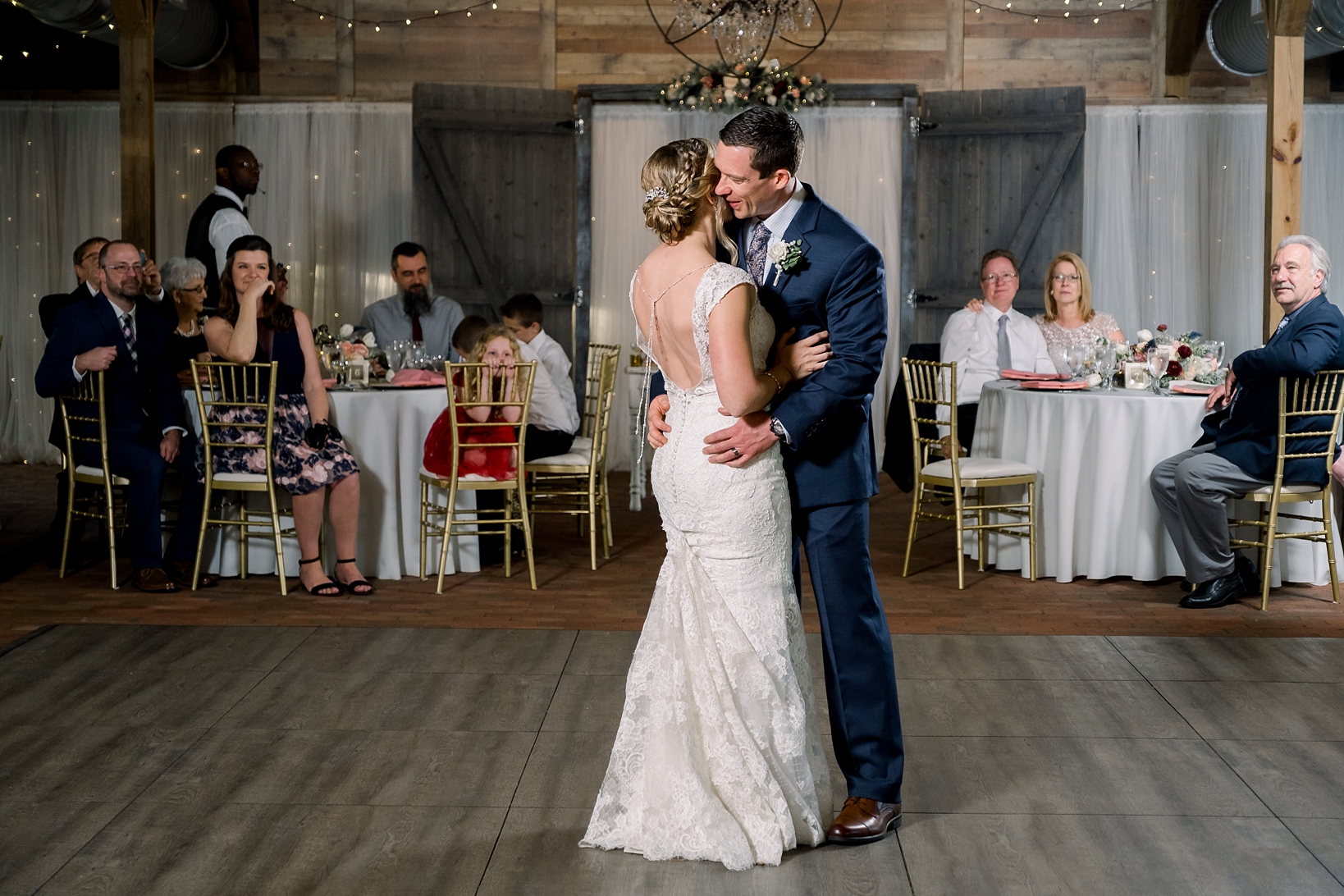 Bride and Groom dance their first dance inside the barn at Cross Creek Ranch in Seffner, FL