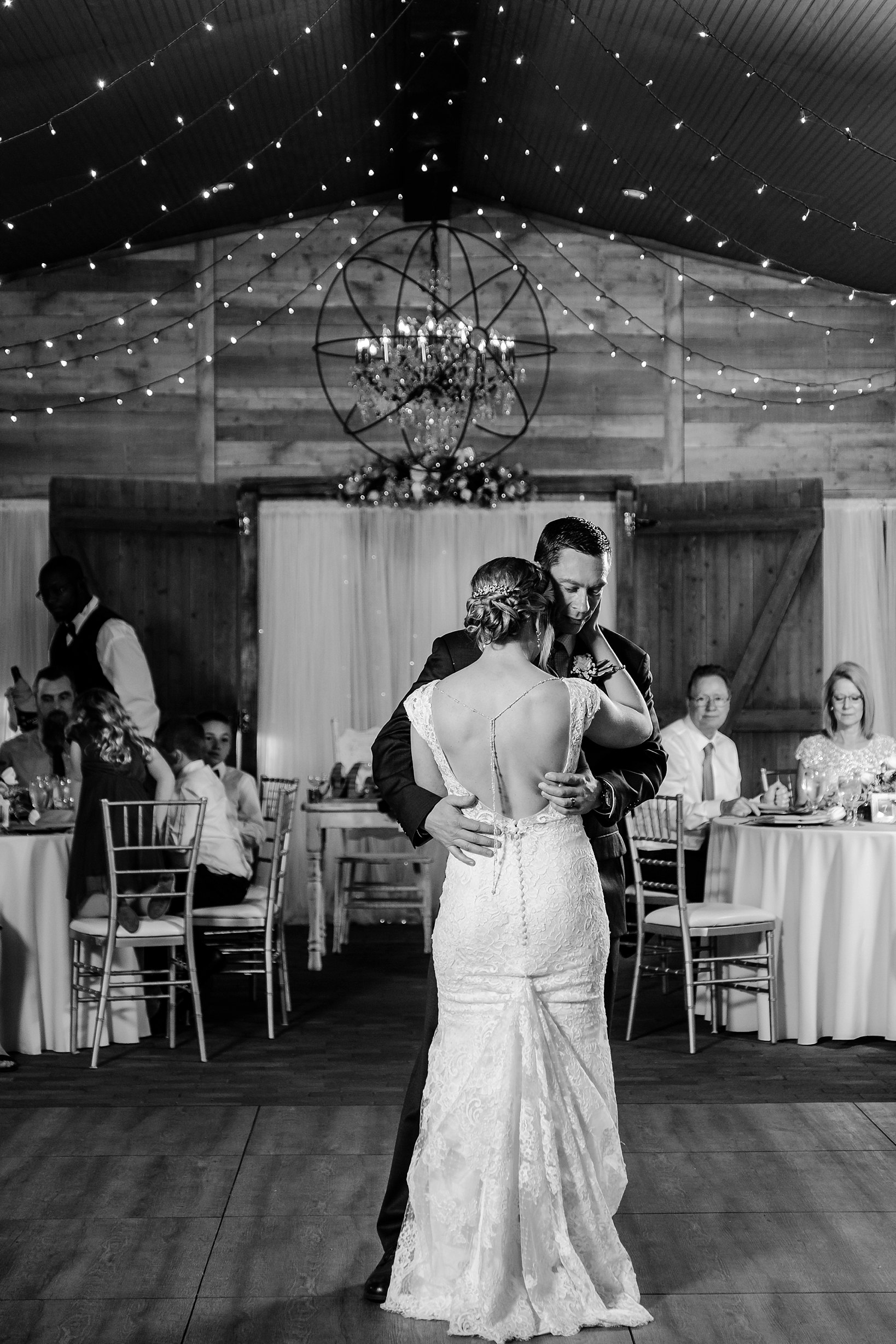 Classic black and white image of a bride and groom dancing during their wedding reception