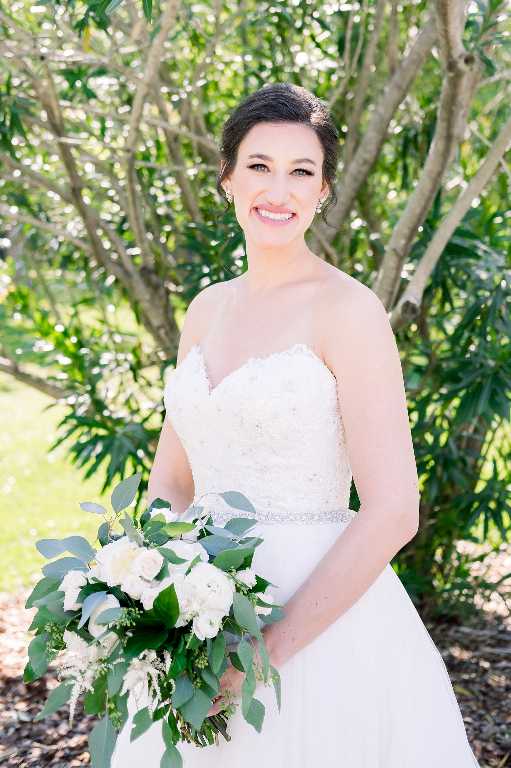 Solo portrait of the bride on her wedding day in the gardens of downtown Tampa, FL
