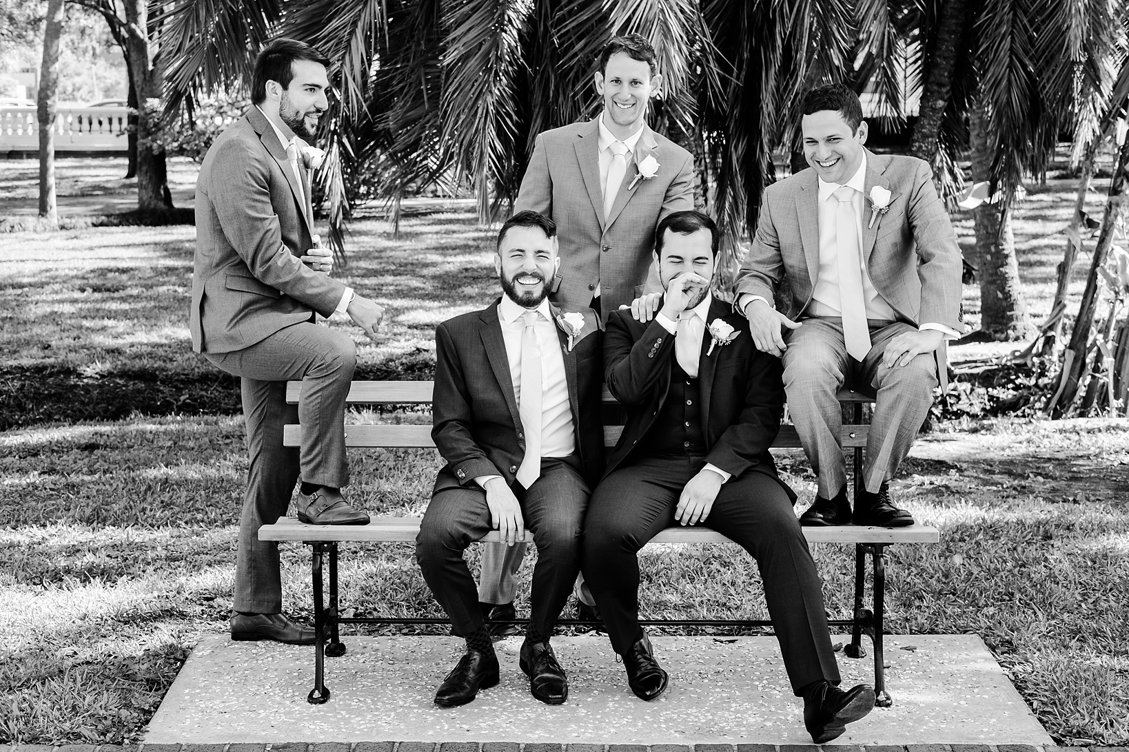 Groom and his Groomsmen share a sincere moment of joy on his wedding day y Sarah & Ben Photography