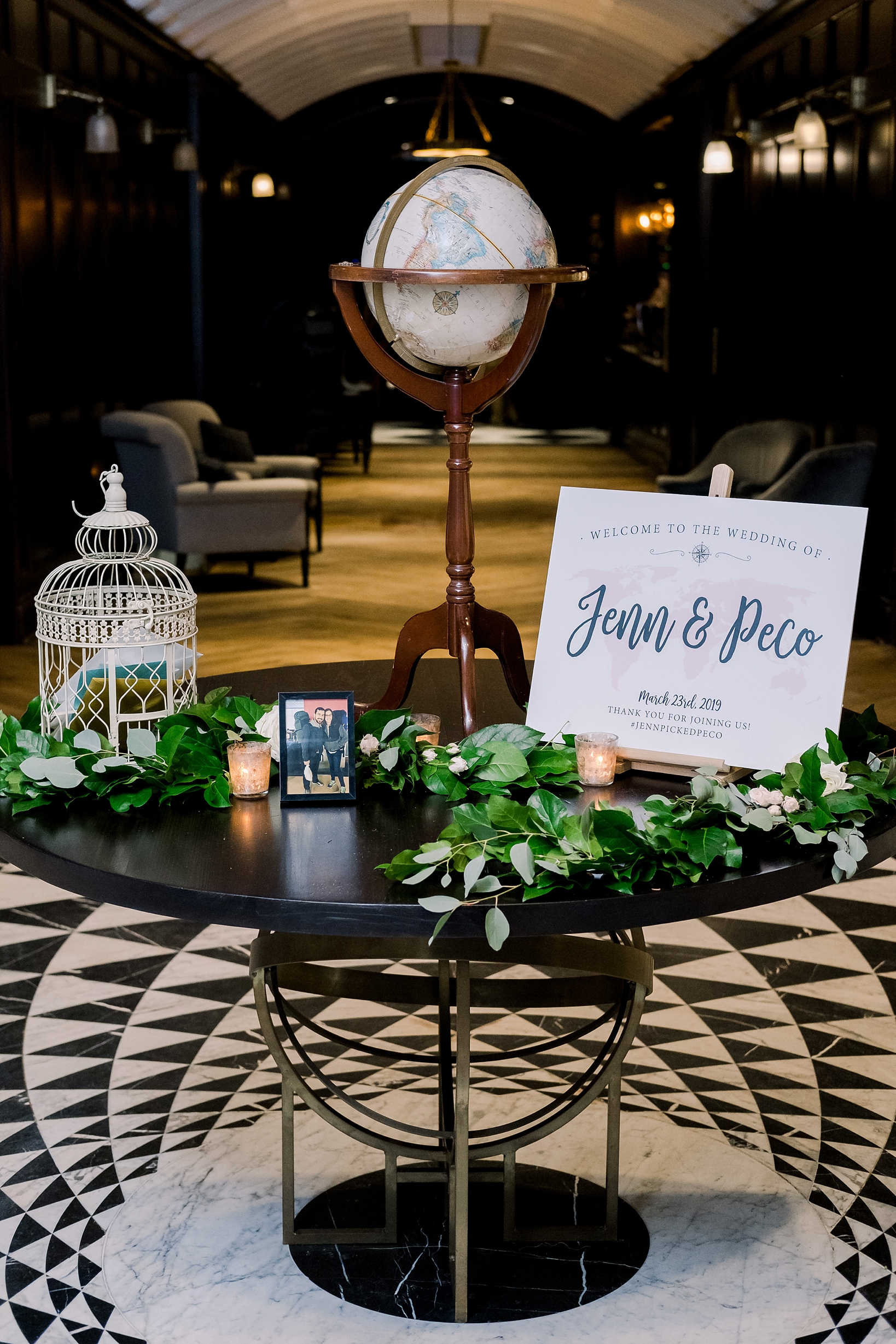 Welcome table in the library that greets guests to their oxford exchange wedding day