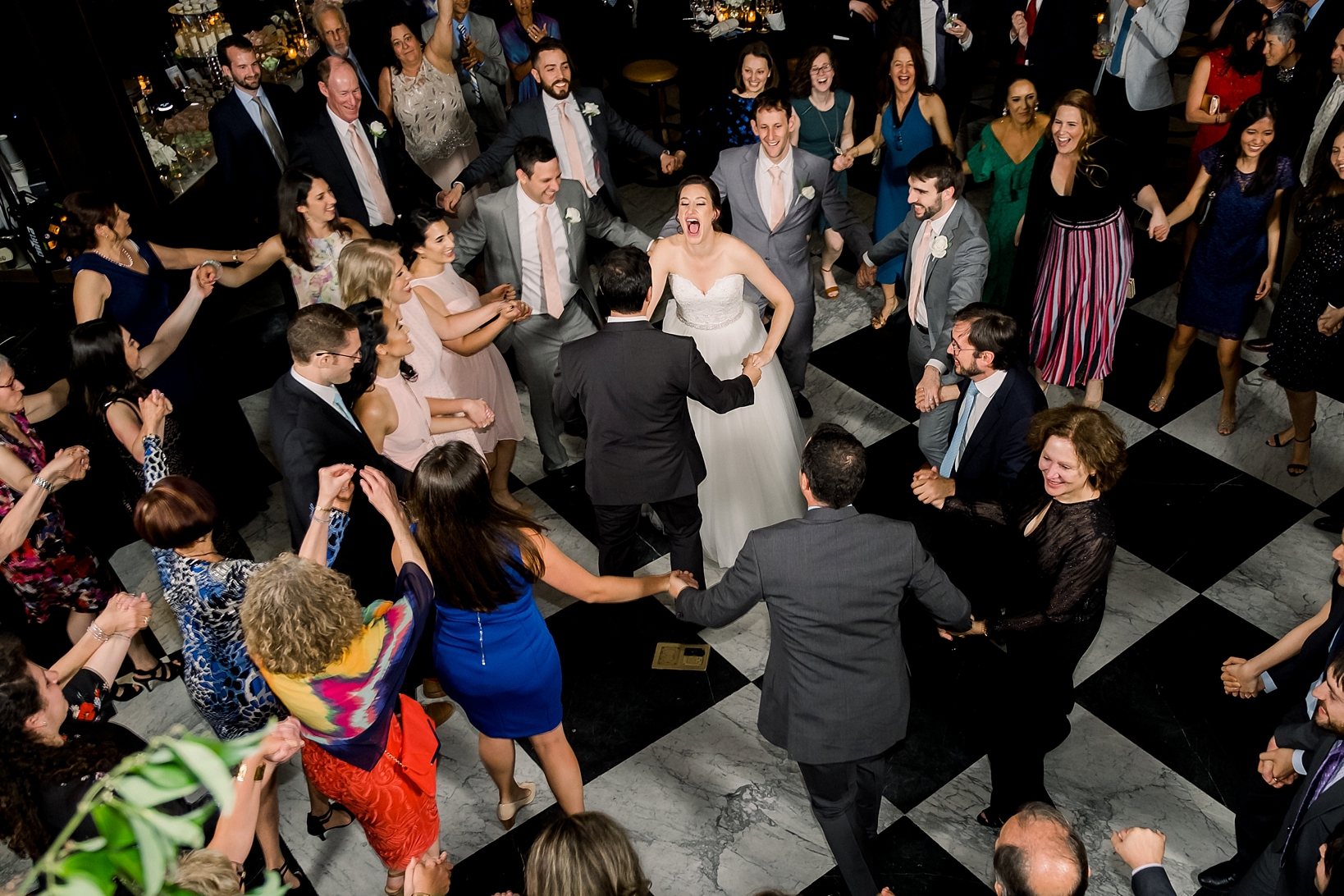 The dance party during this oxford exchange wedding day was one to remember as people groove on the dance floor