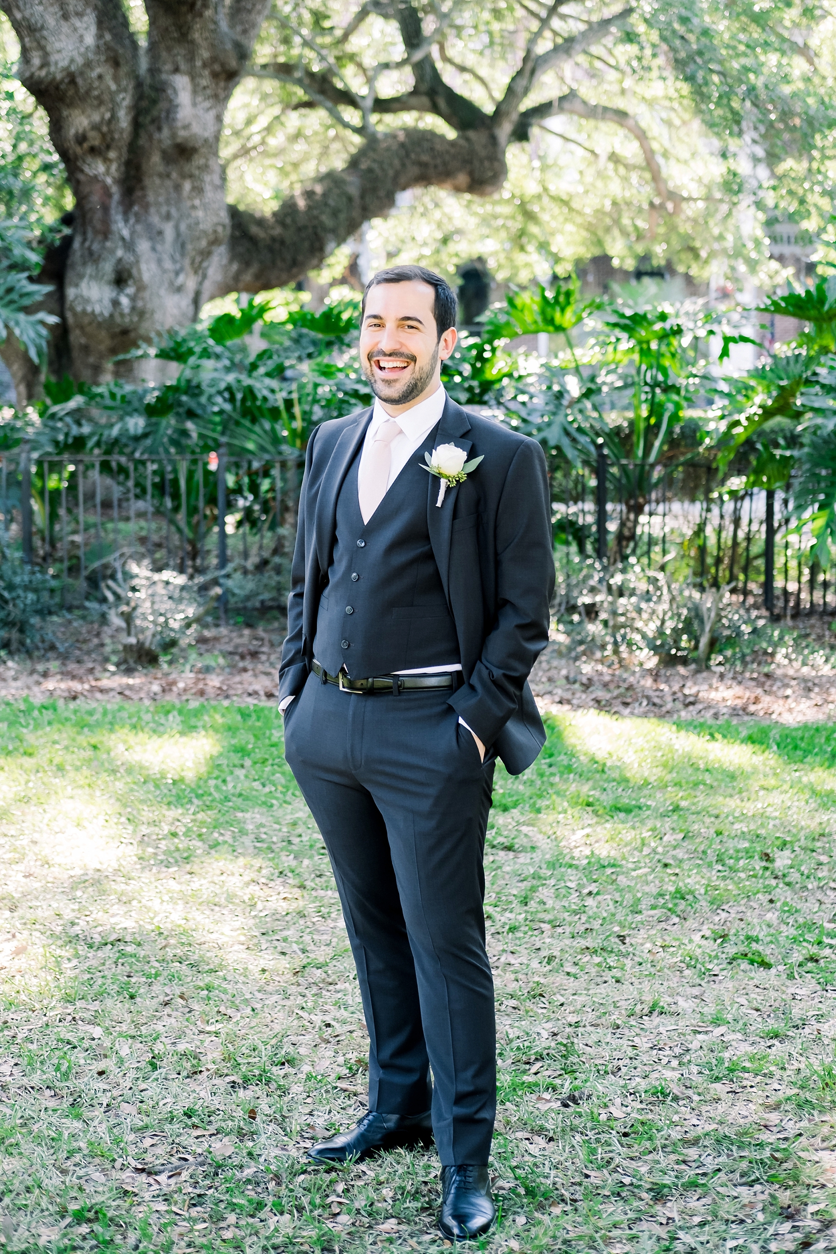 Solo portrait of the Groom under the trees of downtown Tampa, FL